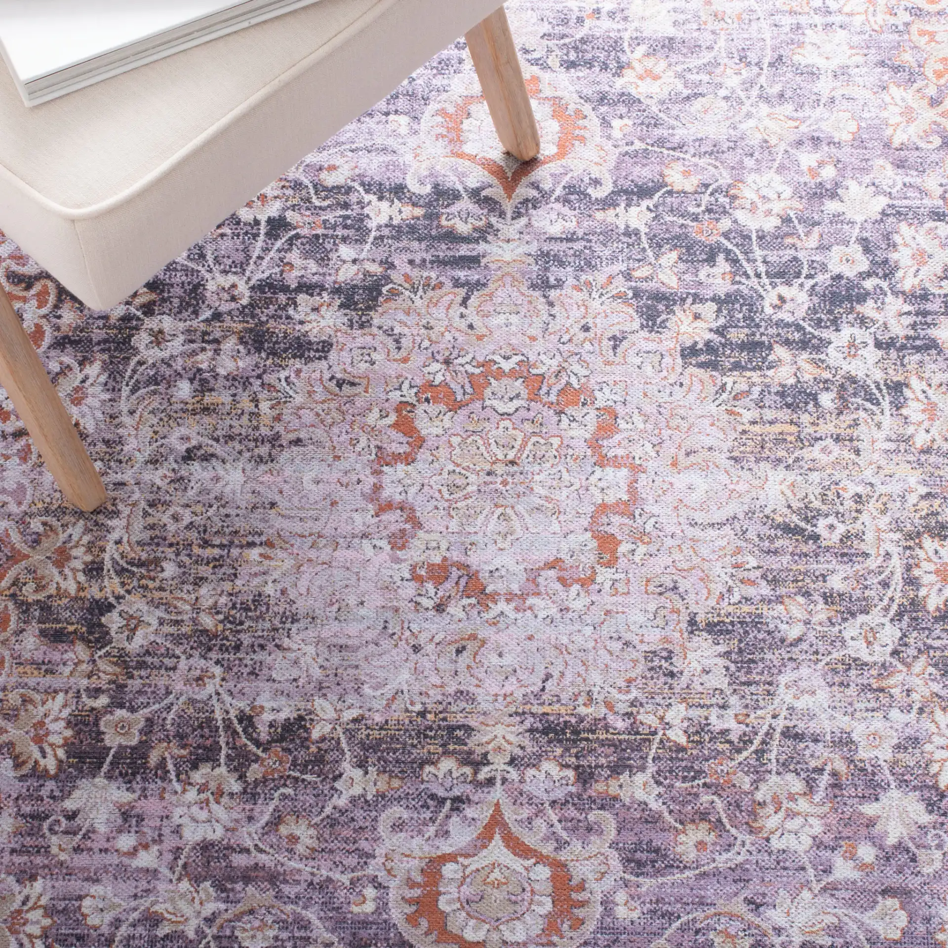Serapi Distressed Medallion Washable Rug in Gray / Light Gray in a styled room