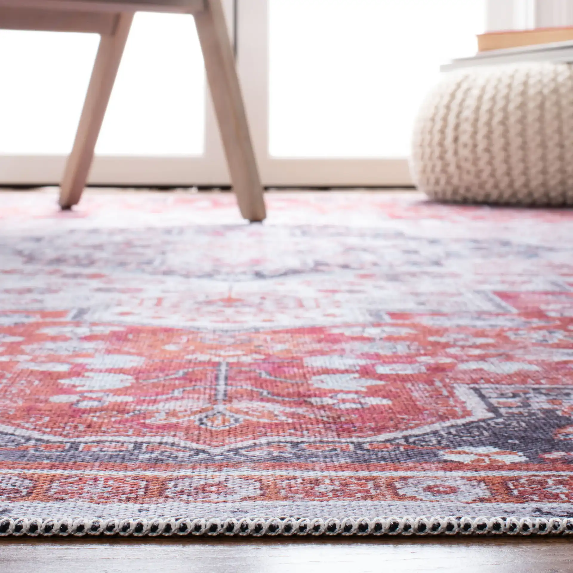 Serapi Nested Medallion Washable Rug in Rust / Ivory in a styled room