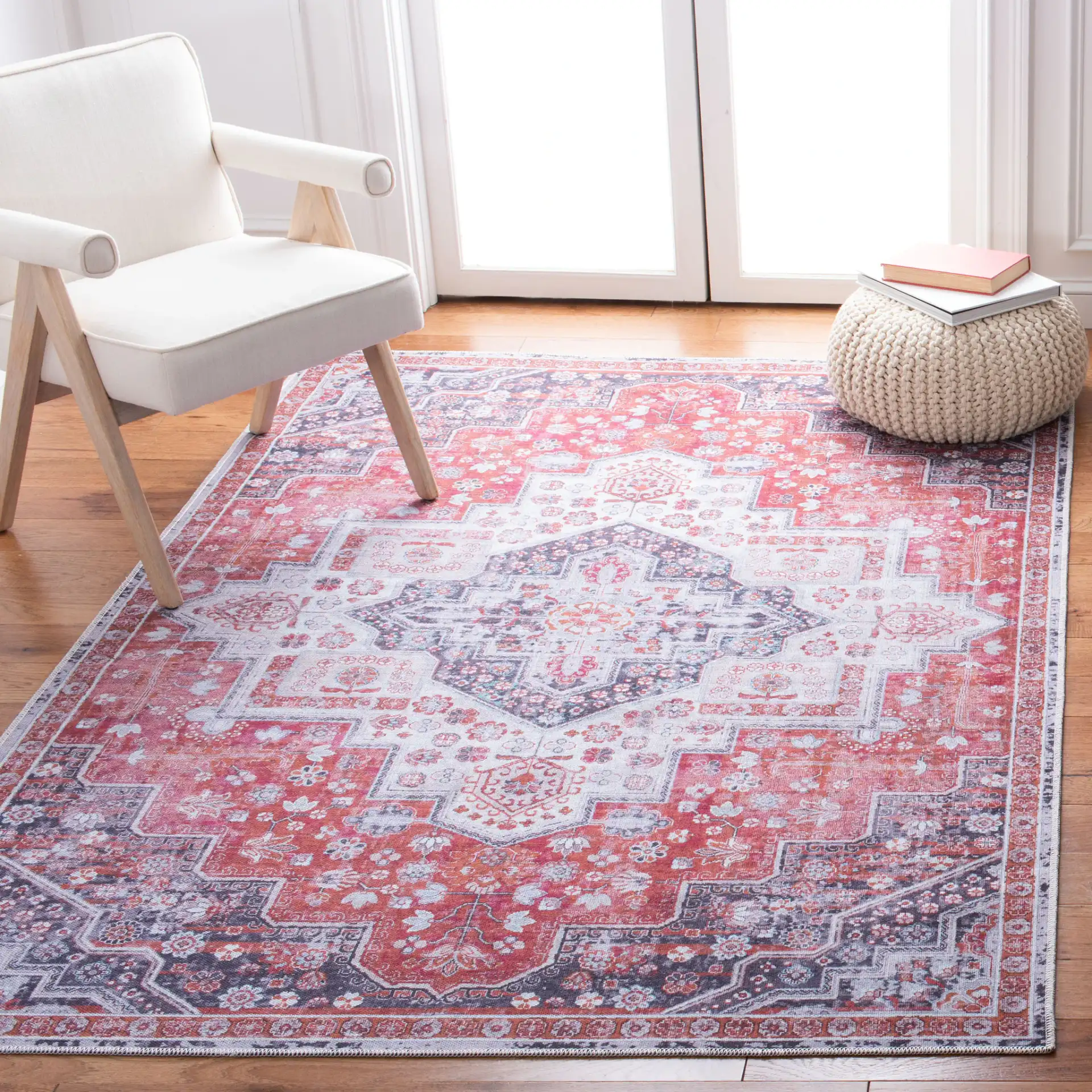 Serapi Nested Medallion Washable Rug in Rust / Ivory in a styled room