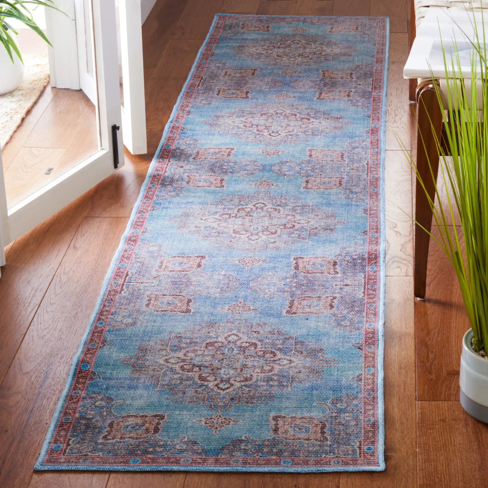 Serapi Medallion Washable Rug in Blue / Brown in a styled room