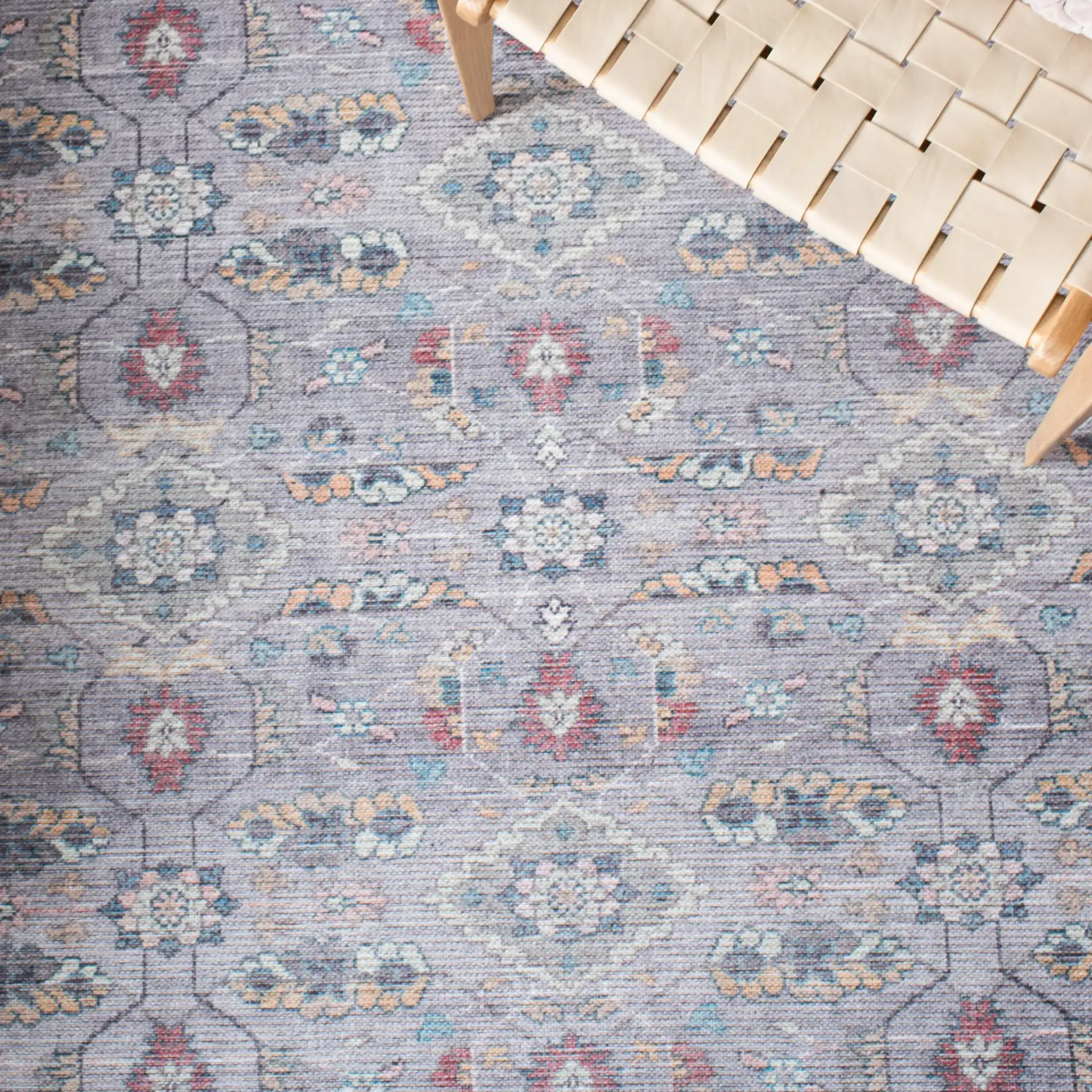 Serapi Floral Border Washable Rug in Gray / Beige in a styled room