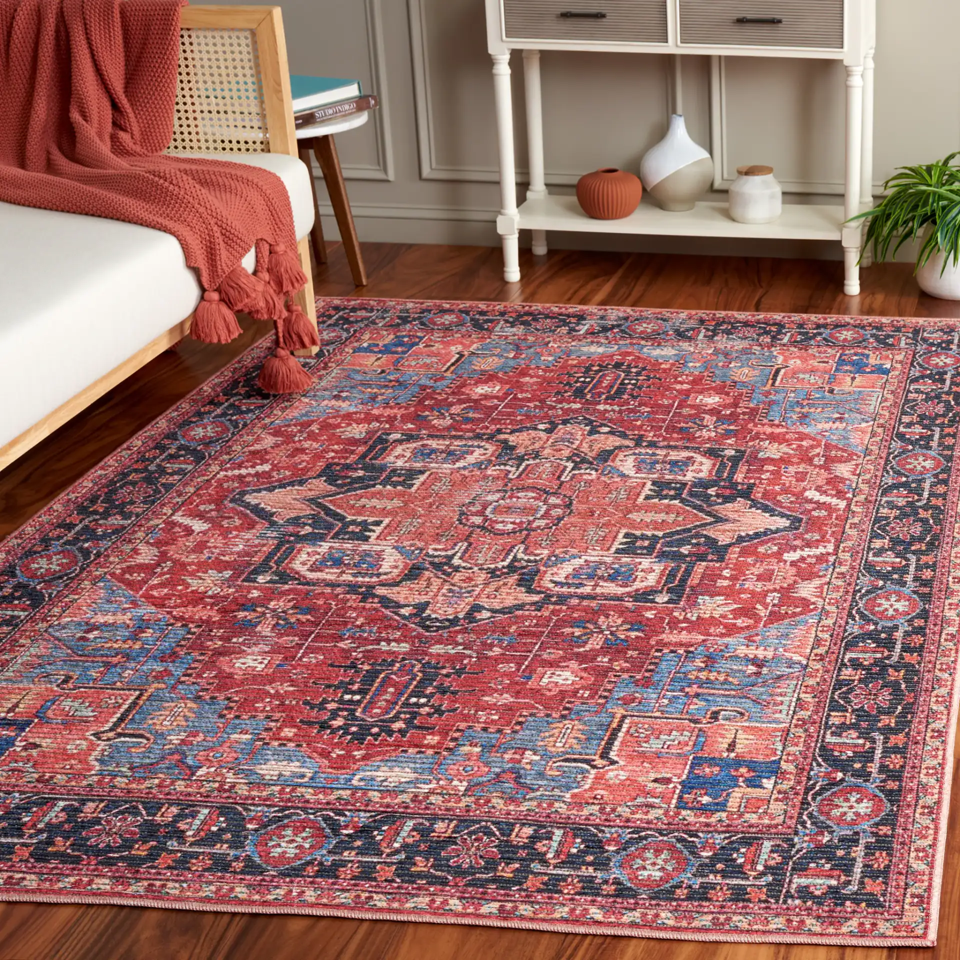Serapi Bordered Medallion Washable Rug in Red / Blue in a styled room