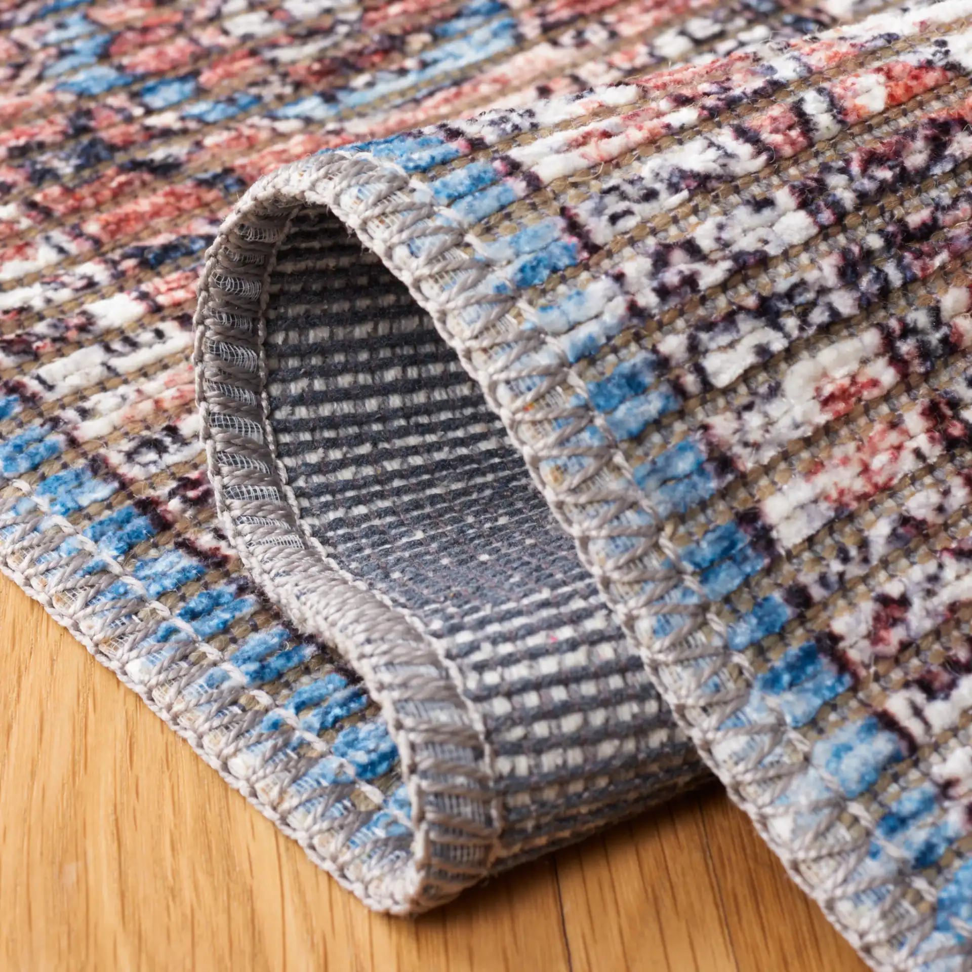 Serapi Framed Medallion Washable Rug in Blue / Rust in a styled room