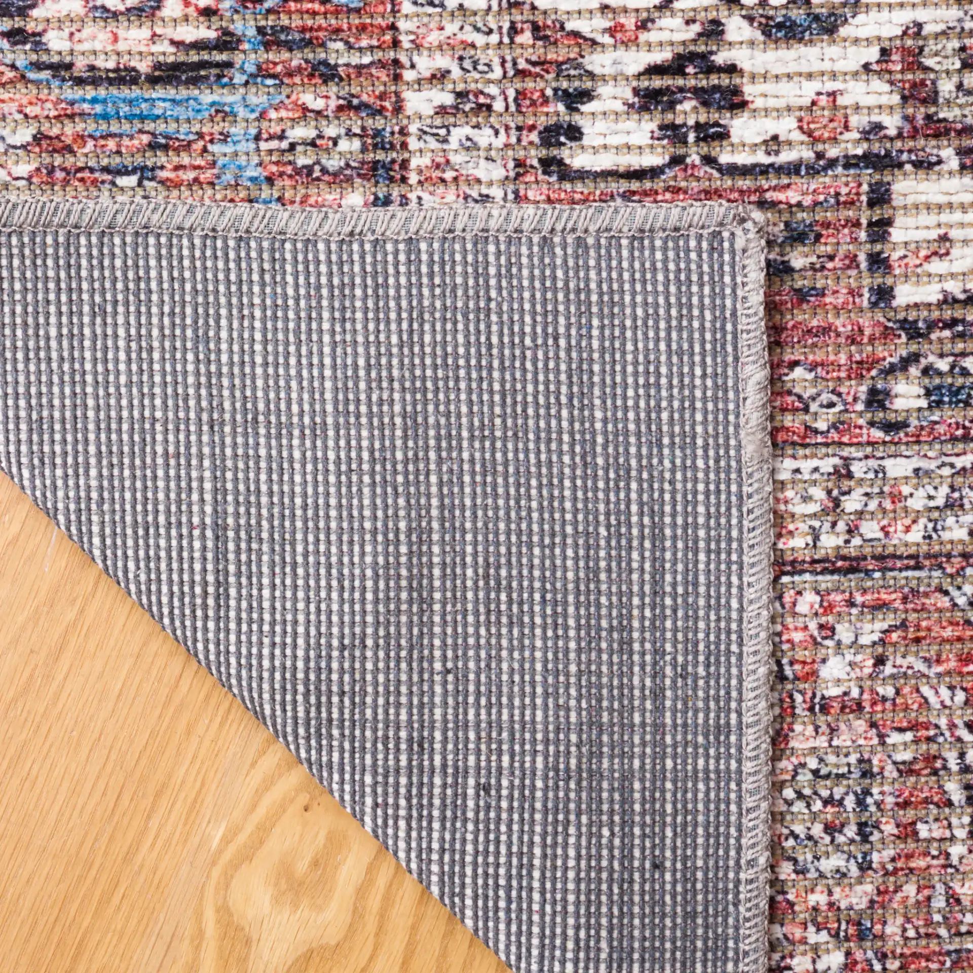 Serapi Framed Medallion Washable Rug in Blue / Rust in a styled room