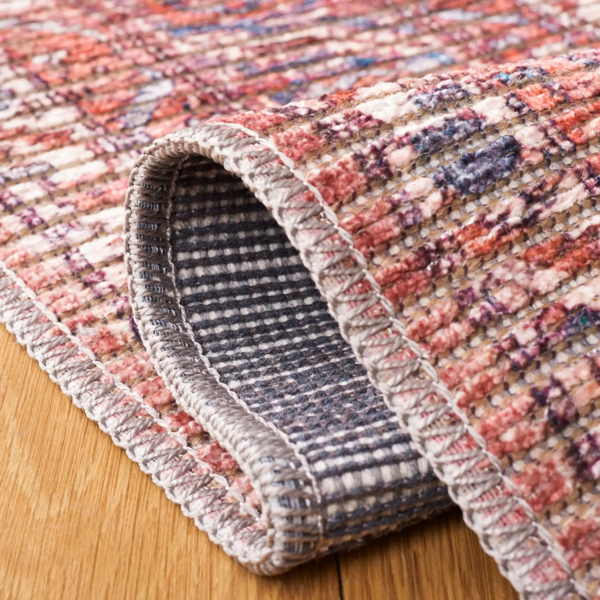 Serapi Distressed Geometric Washable Rug in Rust / Blue in a styled room