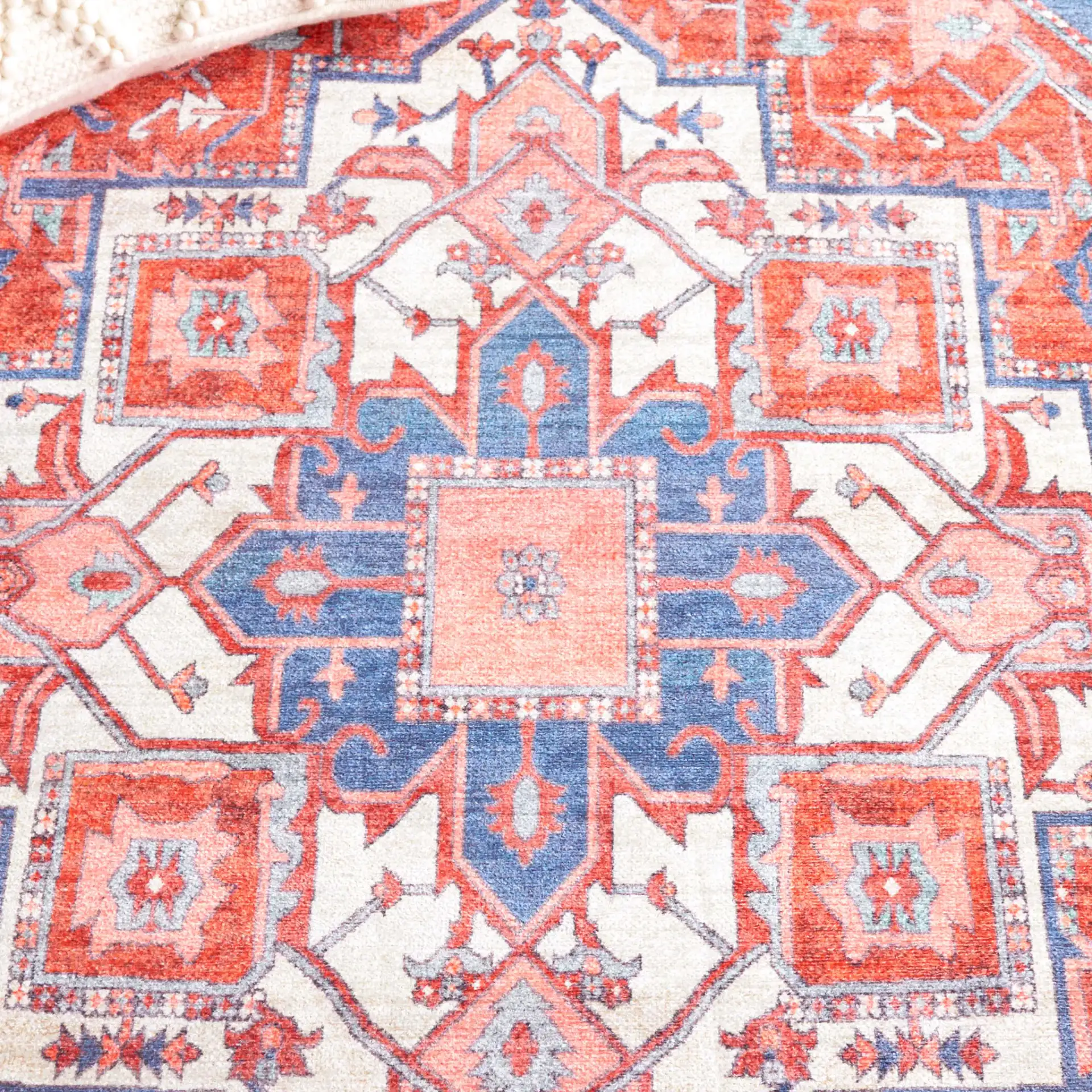 Serapi Geometric Medallion Washable Rug in Rust / Blue in a styled room