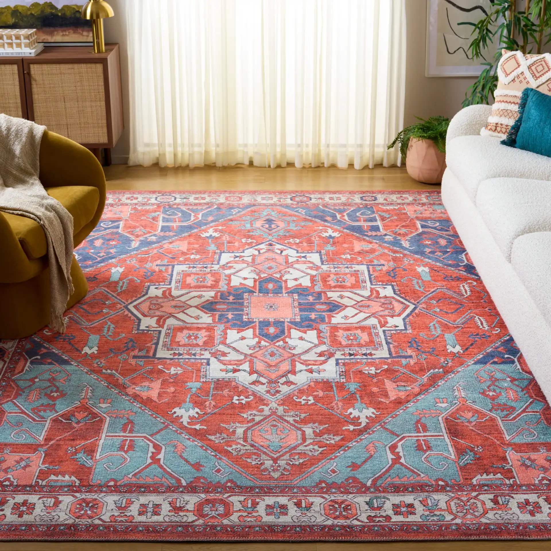 Serapi Geometric Medallion Washable Rug in Rust / Blue in a styled room