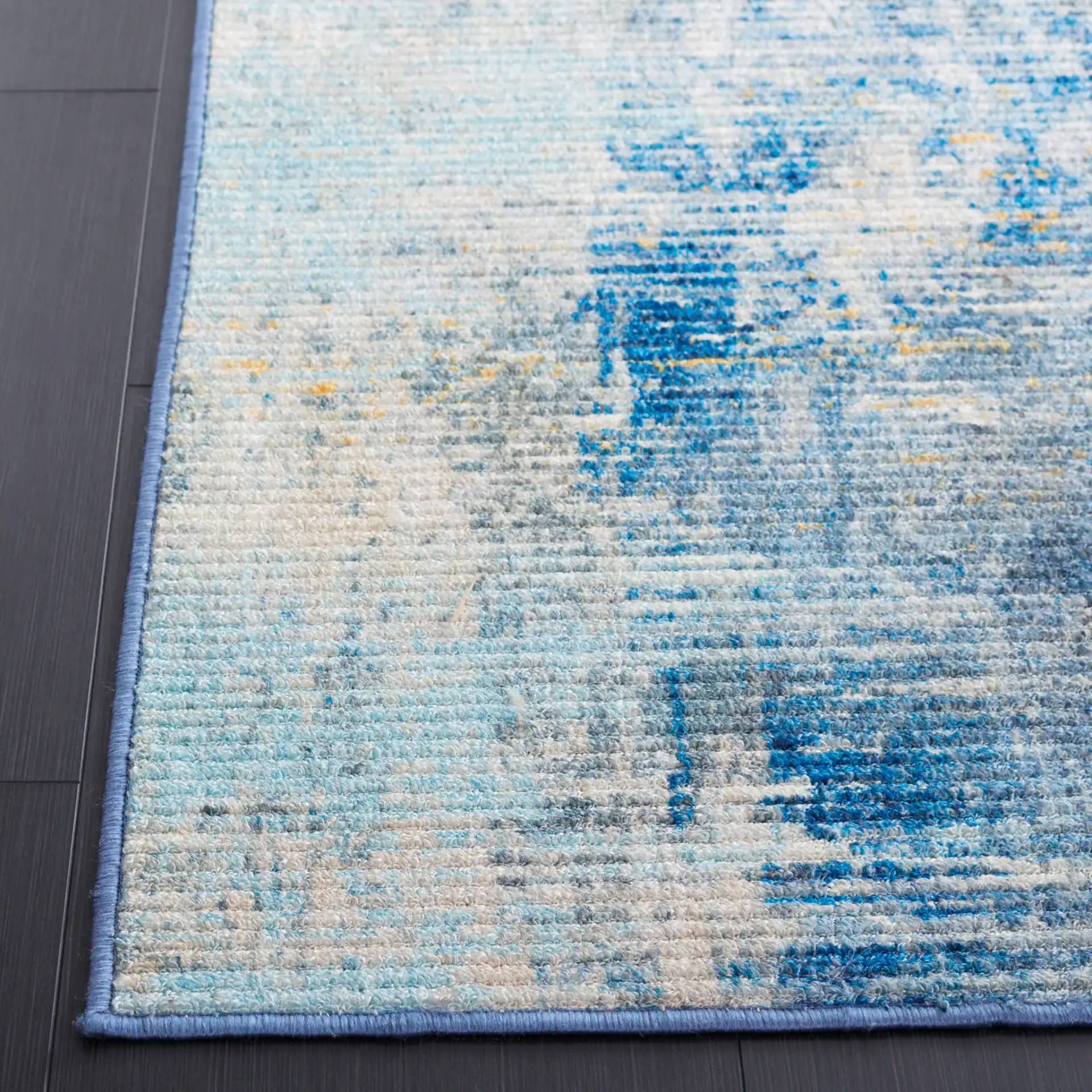 Sequoia Abstract Washable Rug in Ivory Blue / Gold in a styled room