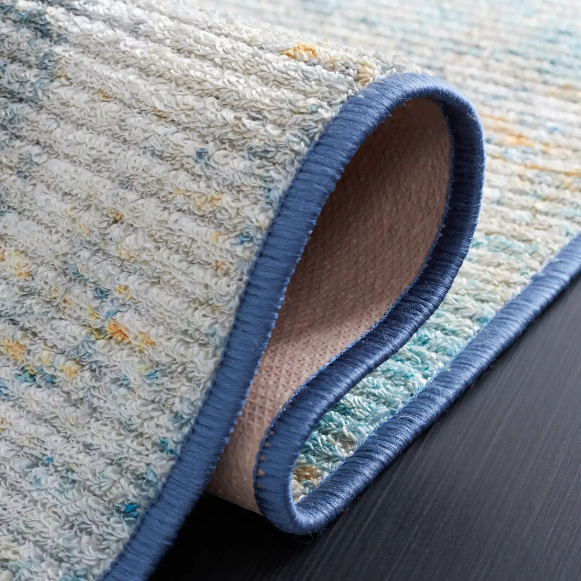 Sequoia Abstract Washable Rug in Ivory Blue / Gold in a styled room