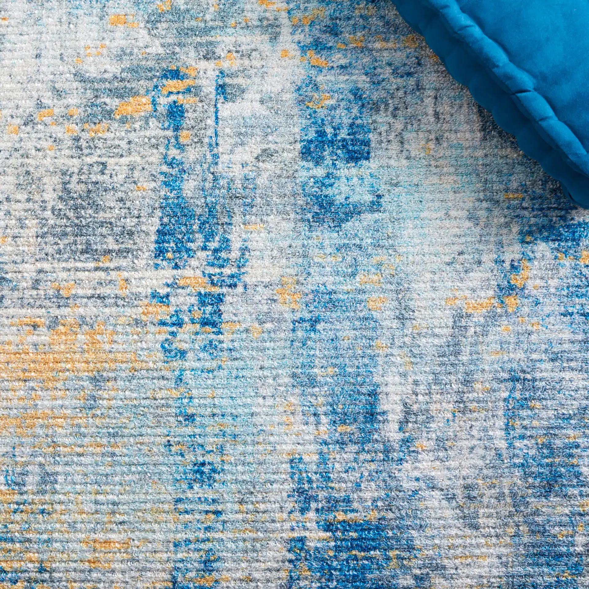 Sequoia Abstract Washable Rug in Ivory Blue / Gold in a styled room