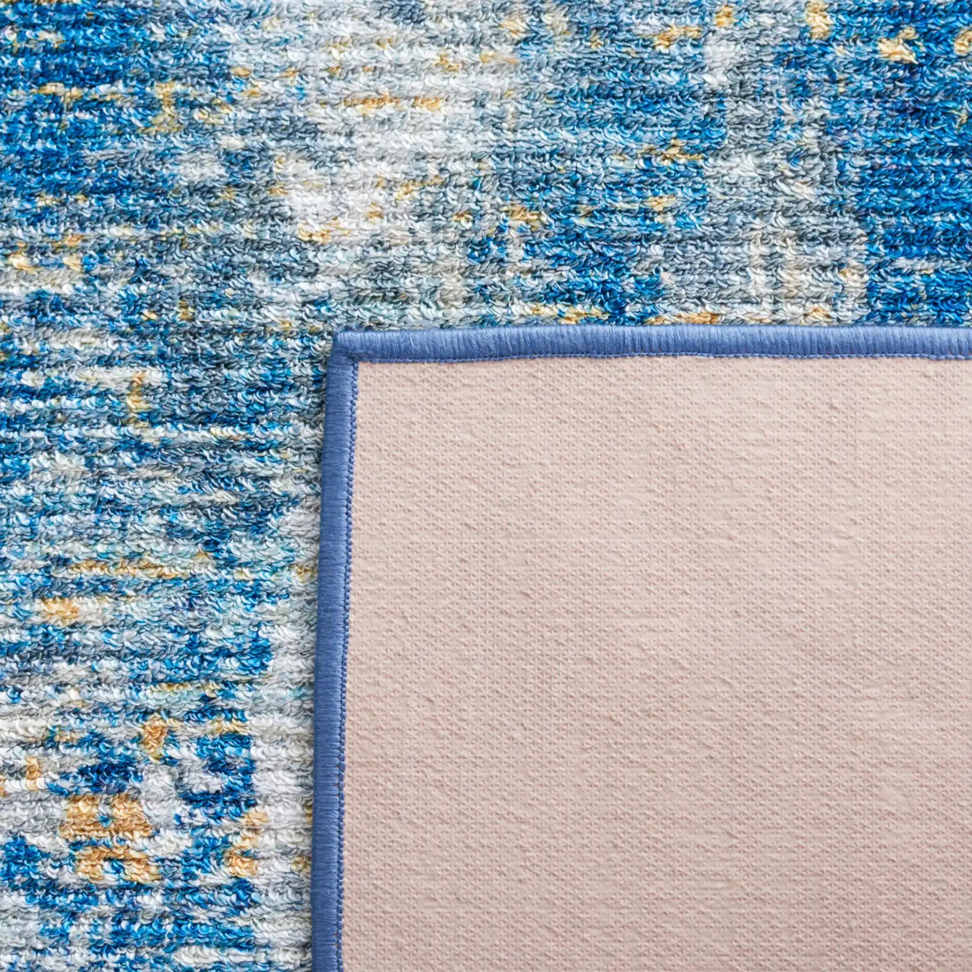 Sequoia Abstract Washable Rug in Ivory Blue / Gold in a styled room
