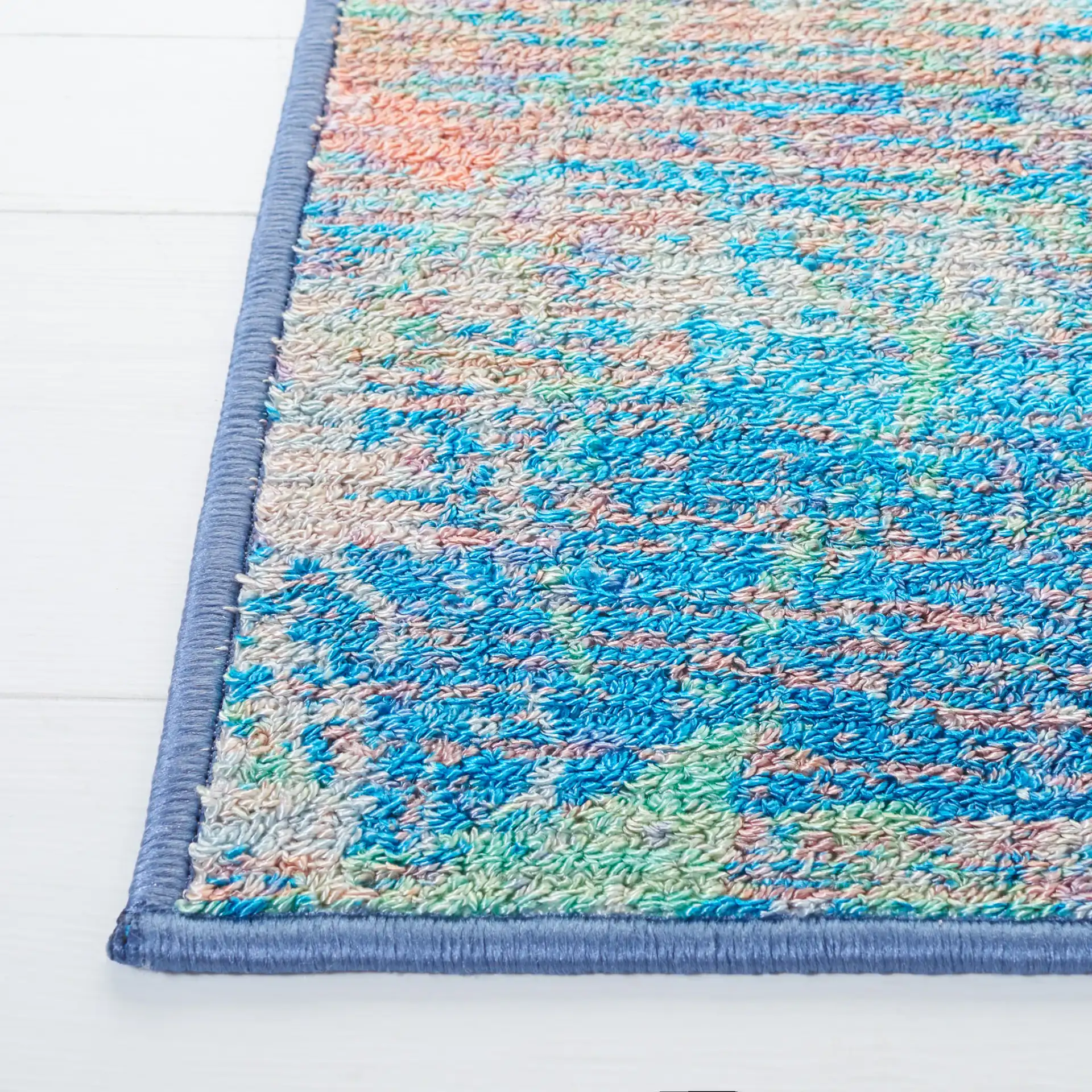 Sequoia Cloud Abstract Washable Rug in Blue / Orange in a styled room