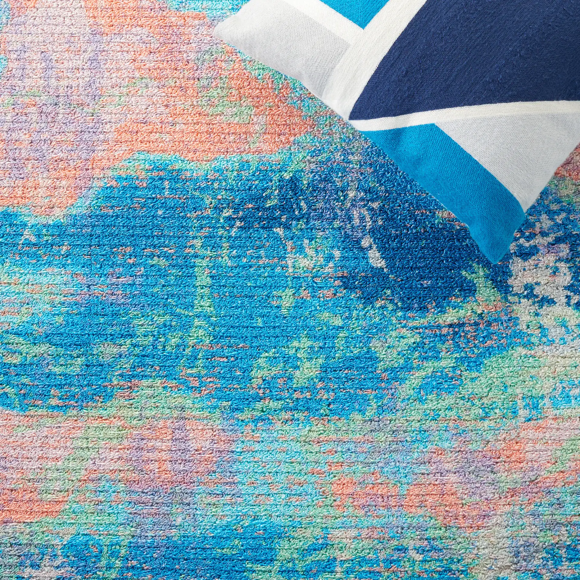 Sequoia Cloud Abstract Washable Rug in Blue / Orange in a styled room