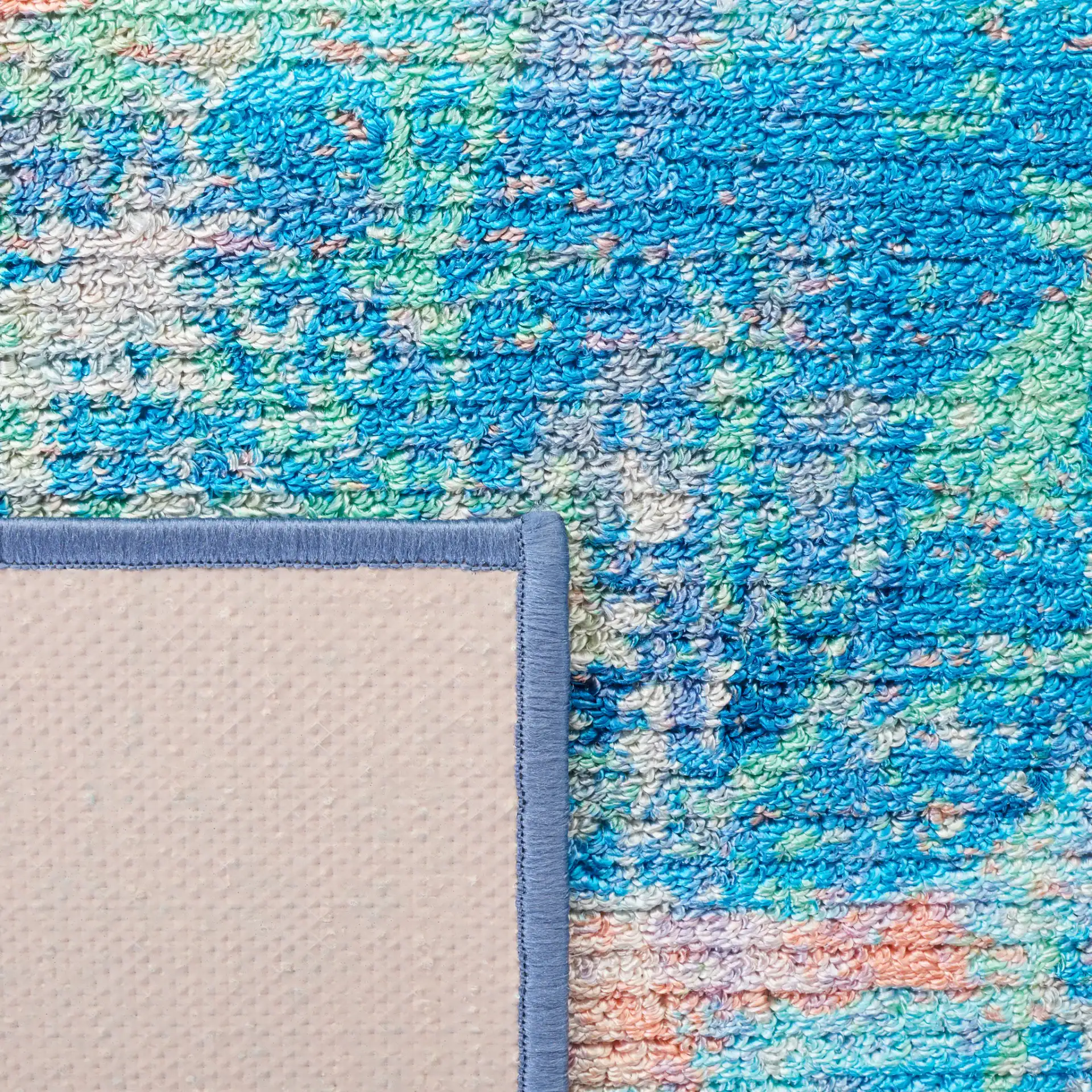 Sequoia Cloud Abstract Washable Rug in Blue / Orange in a styled room