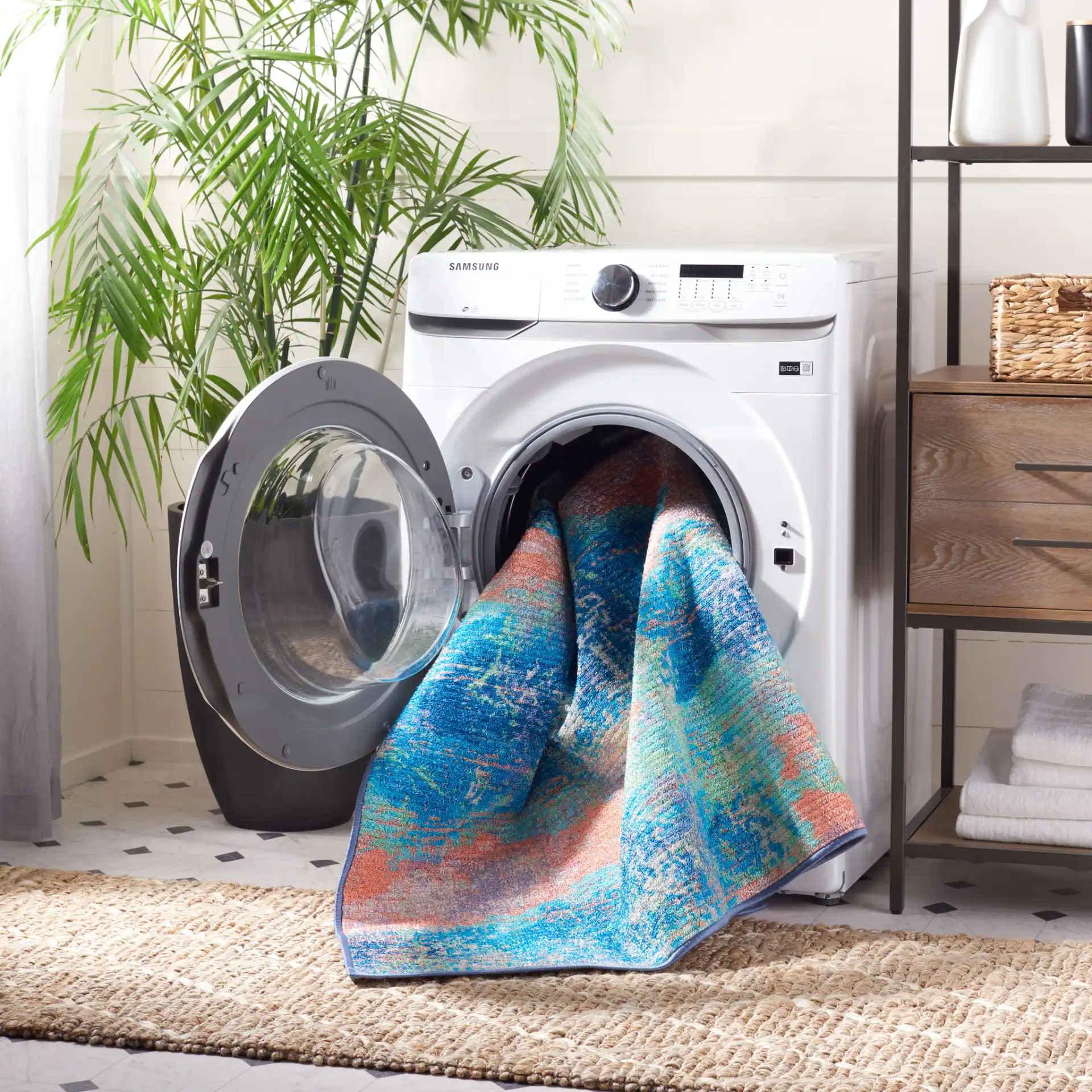 Sequoia Cloud Abstract Washable Rug in Blue / Orange in a styled room