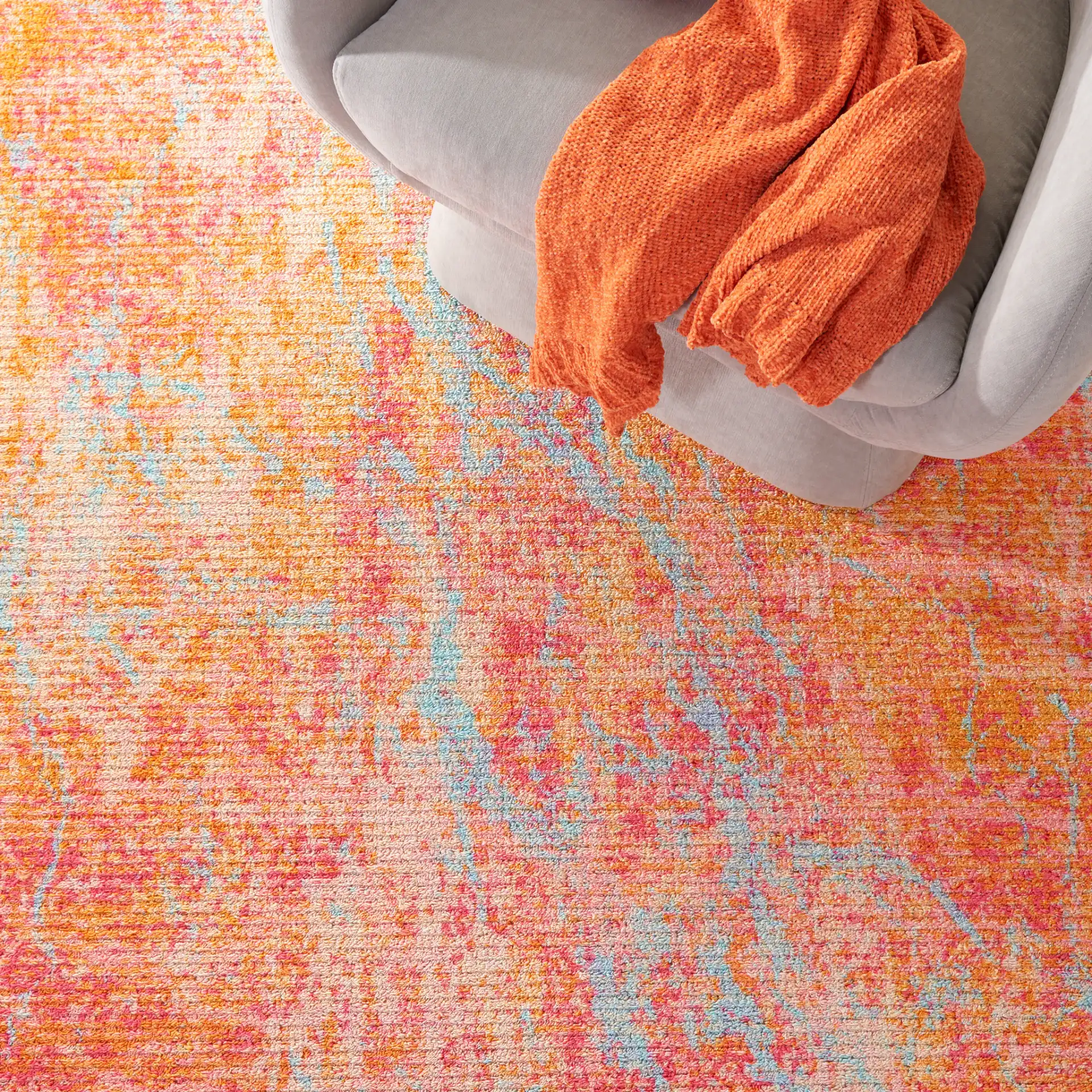 Sequoia Marble Abstract Washable Rug in Orange / Light Blue in a styled room