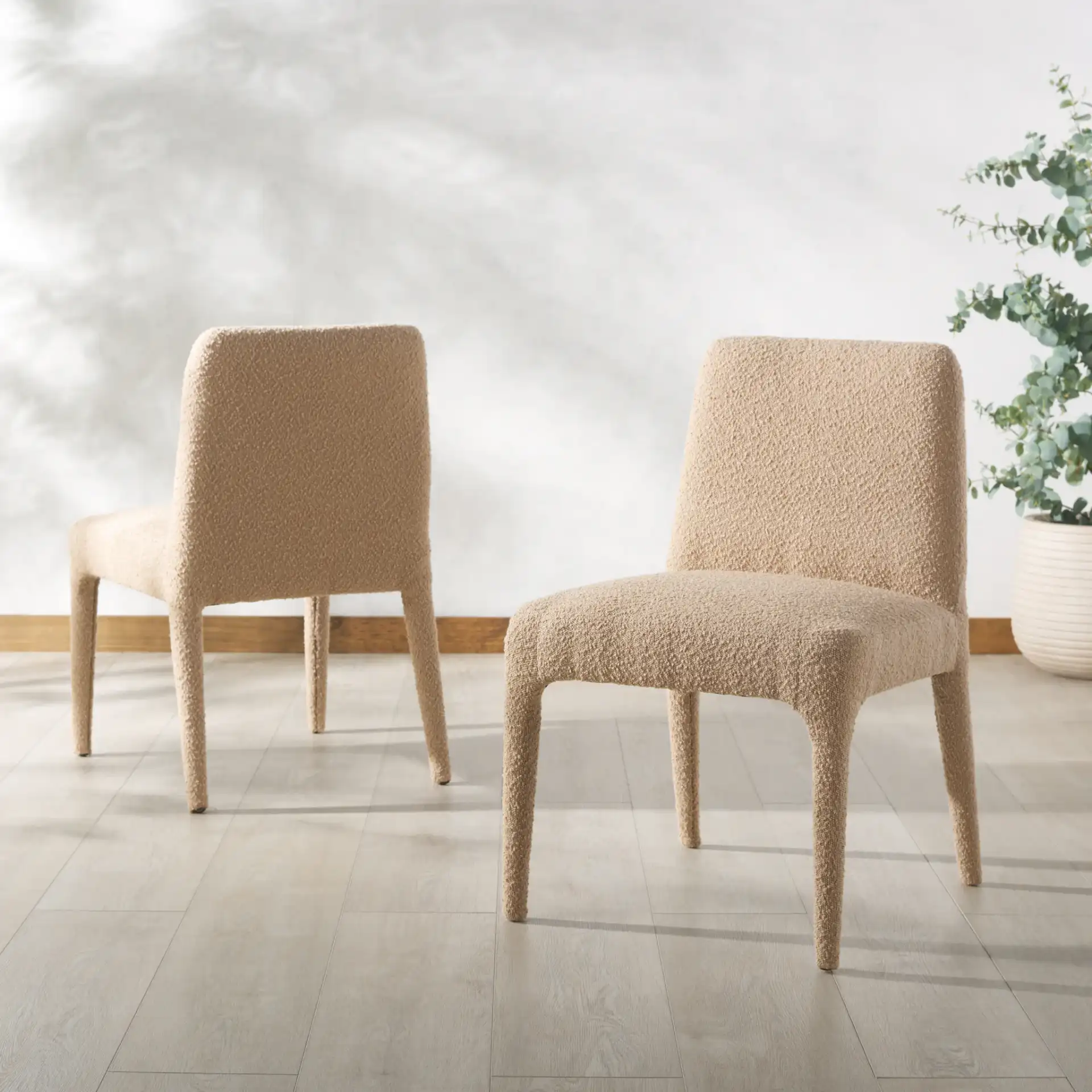 Derrick Boucle Dining Chair (Set Of 2) in Rusty Orange in a styled room