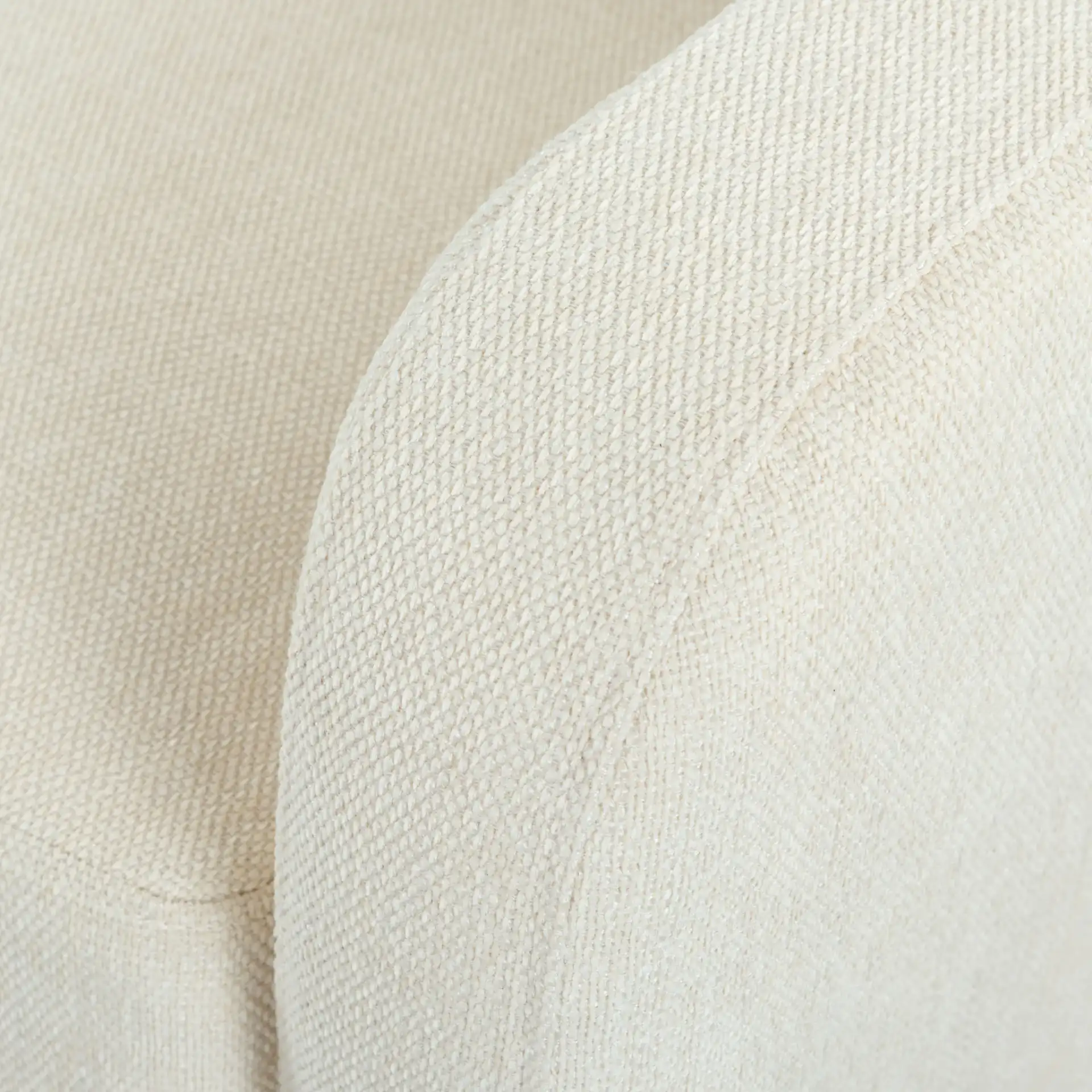 Nathaniel Tufted Three-Seater Sofa in Cream in a styled room