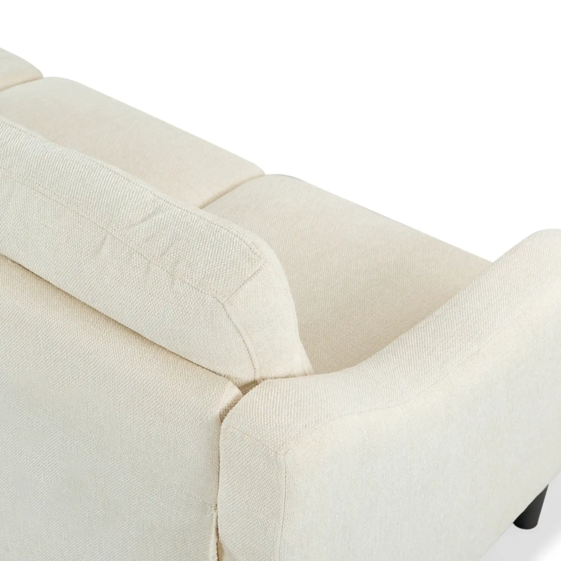 Nathaniel Tufted Three-Seater Sofa in Cream in a styled room