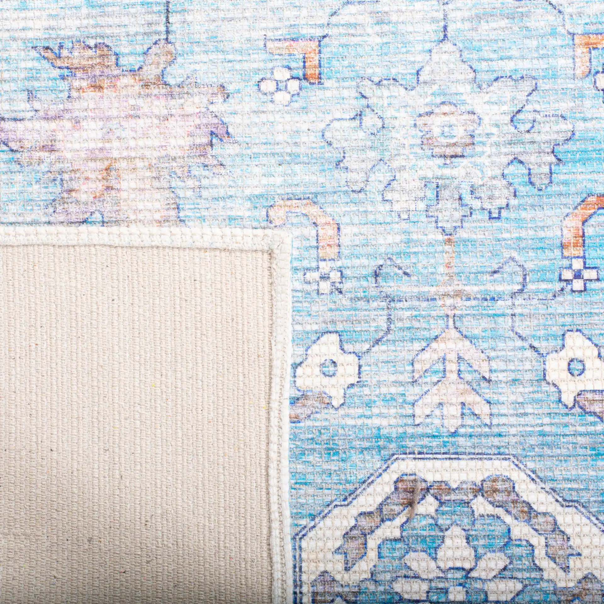 Saffron Medallion Bordered Rug in Aqua / Navy in a styled room