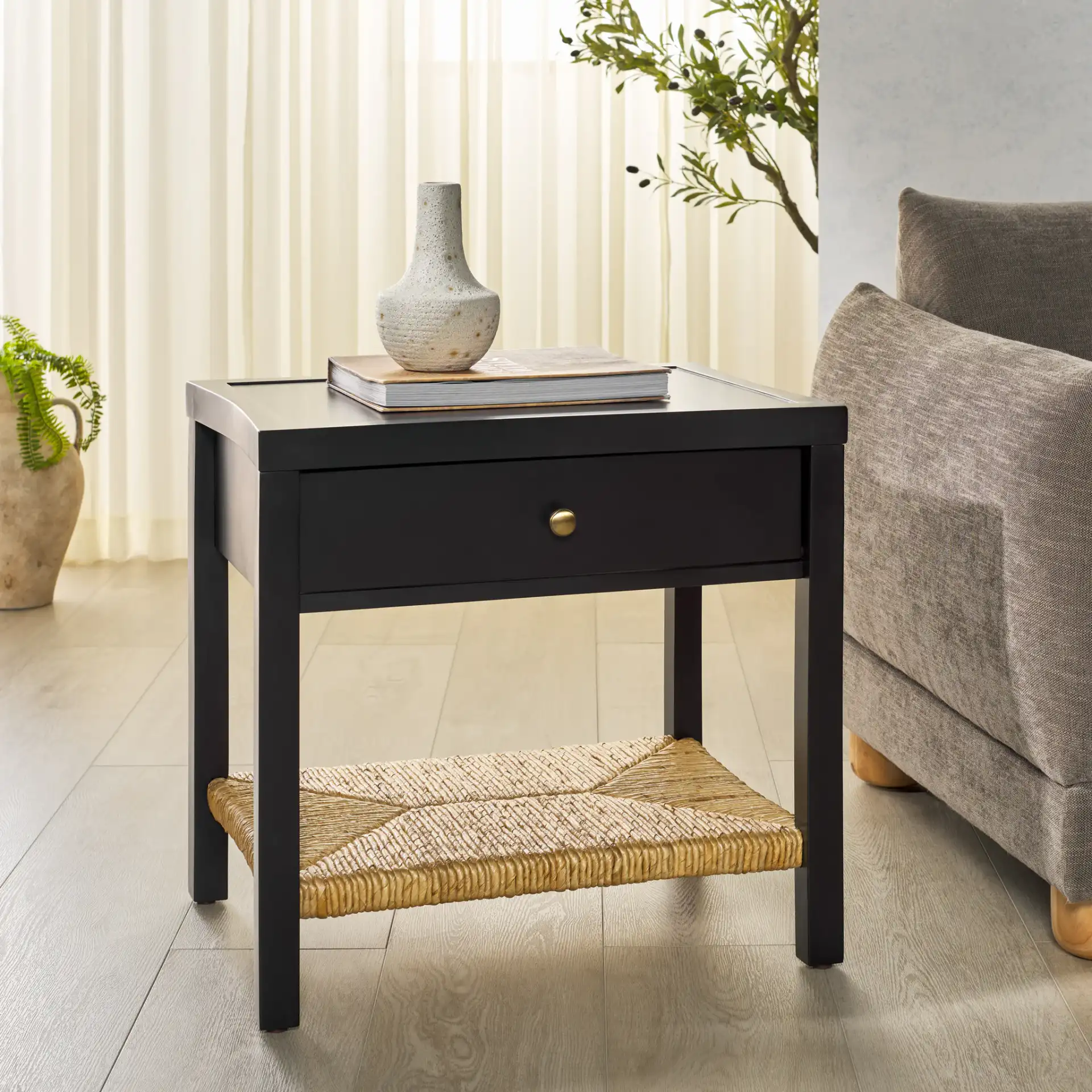 Berlynne Banana Stem Nightstand in Black / Natural in a styled room