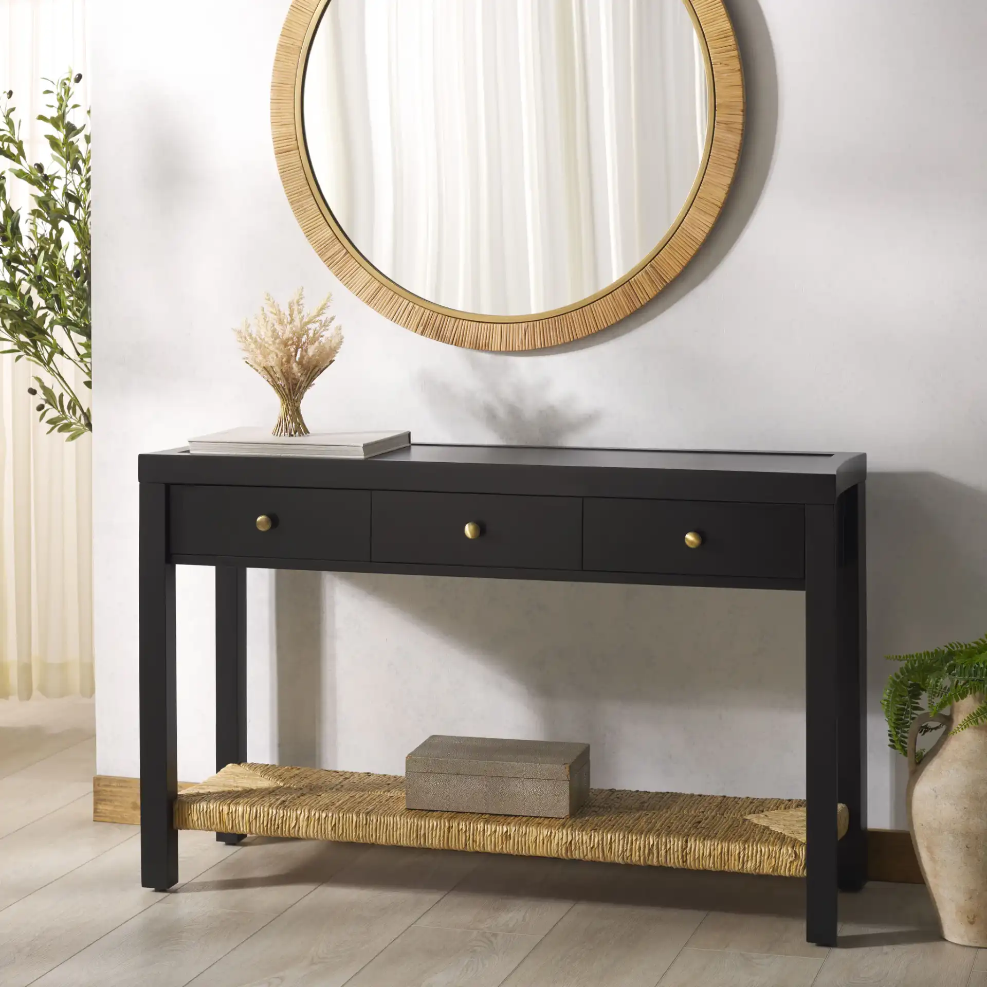 Berlynne Banana Console Table in Black / Natural in a styled room