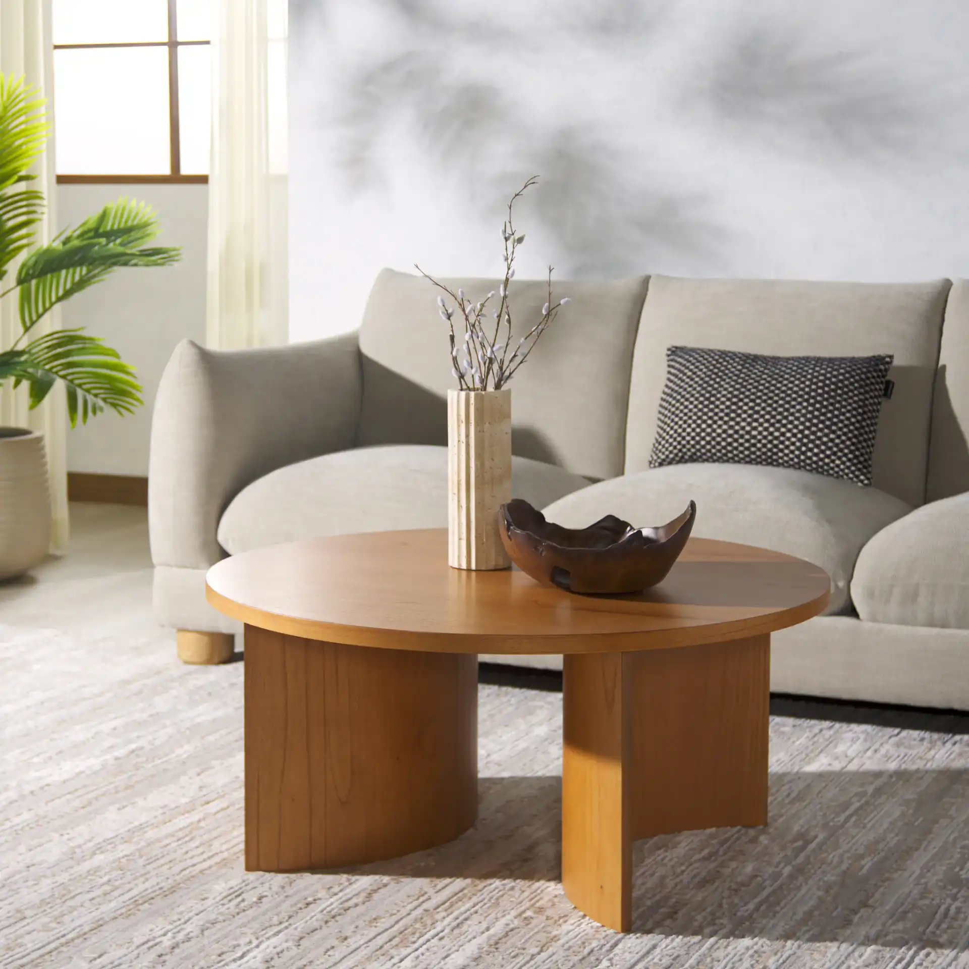 Audriella Round Wood Coffee Table in Natural in a styled room