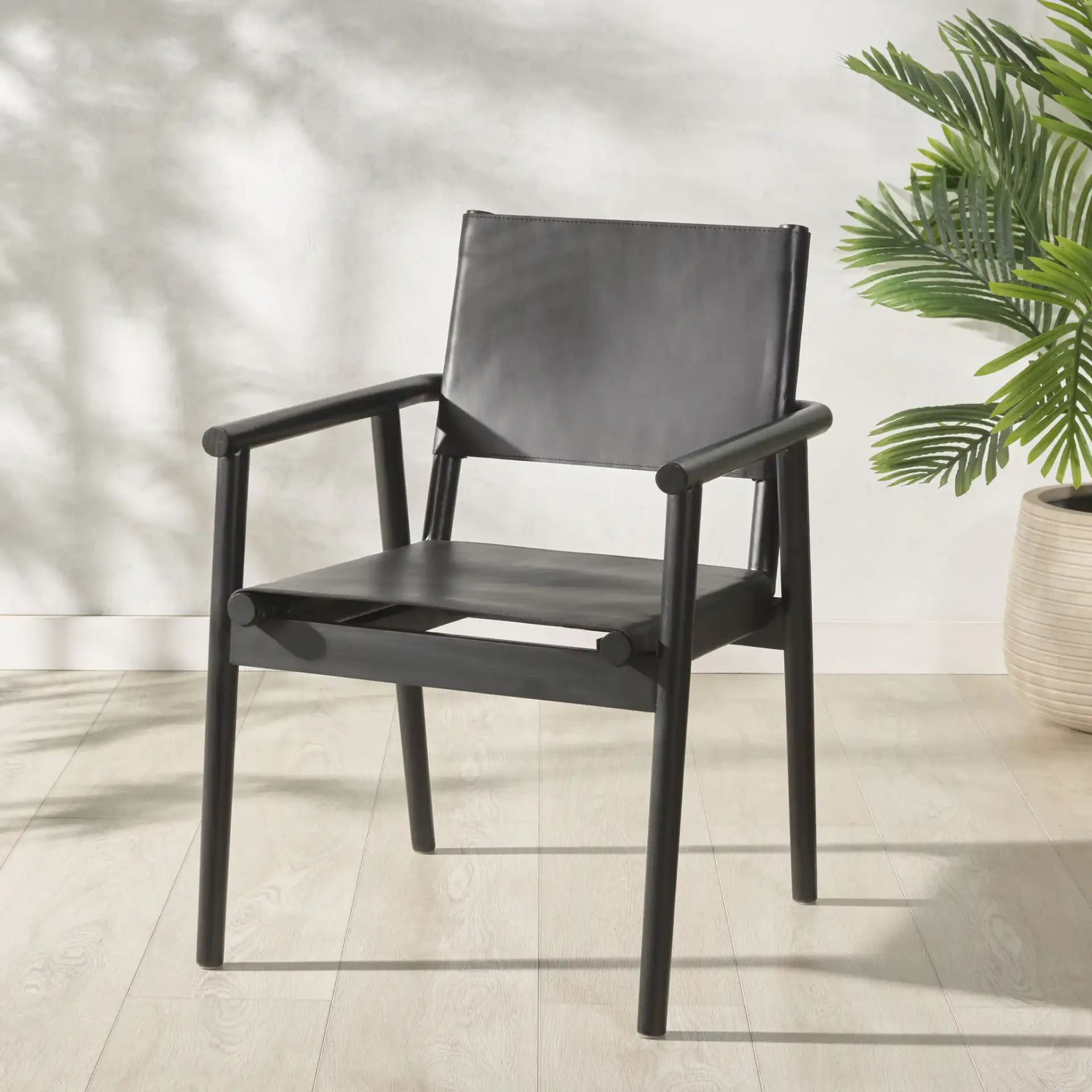 Hutson Leather Dining Chair in Tan / Natural in a styled room