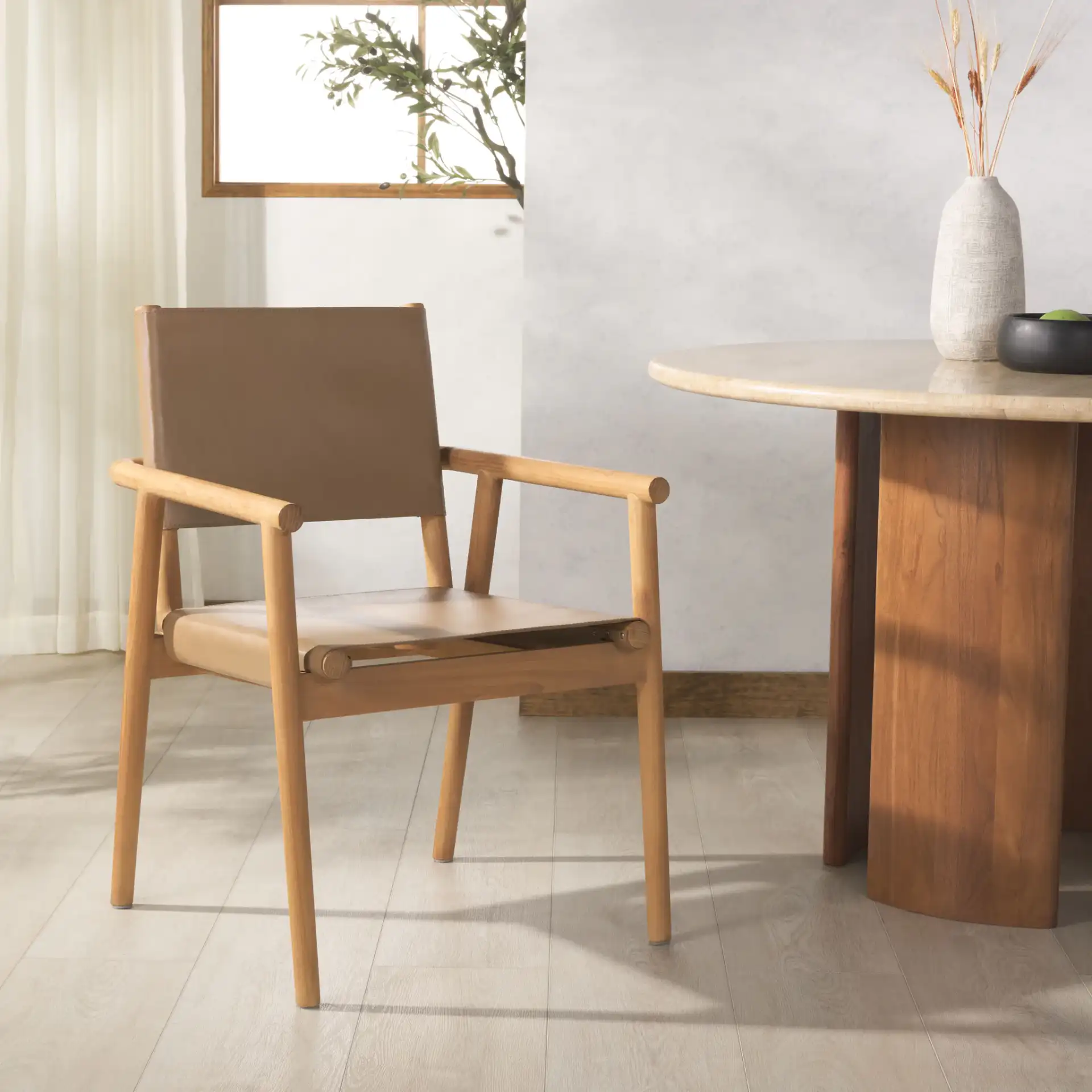 Hutson Leather Dining Chair in Tan / Natural in a styled room