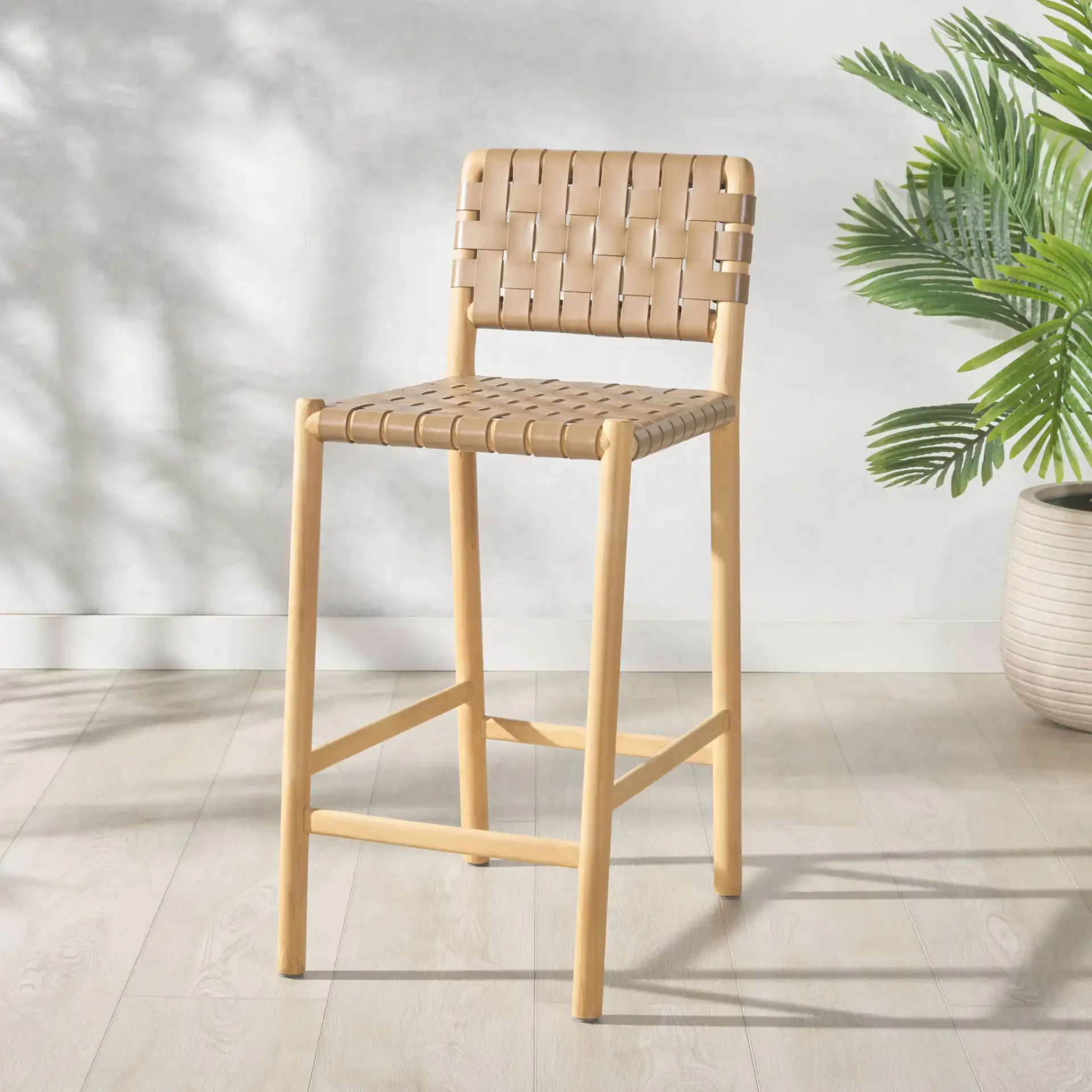 Jeremiah Woven Leather Counter Stool in Brown / Natural in a styled room