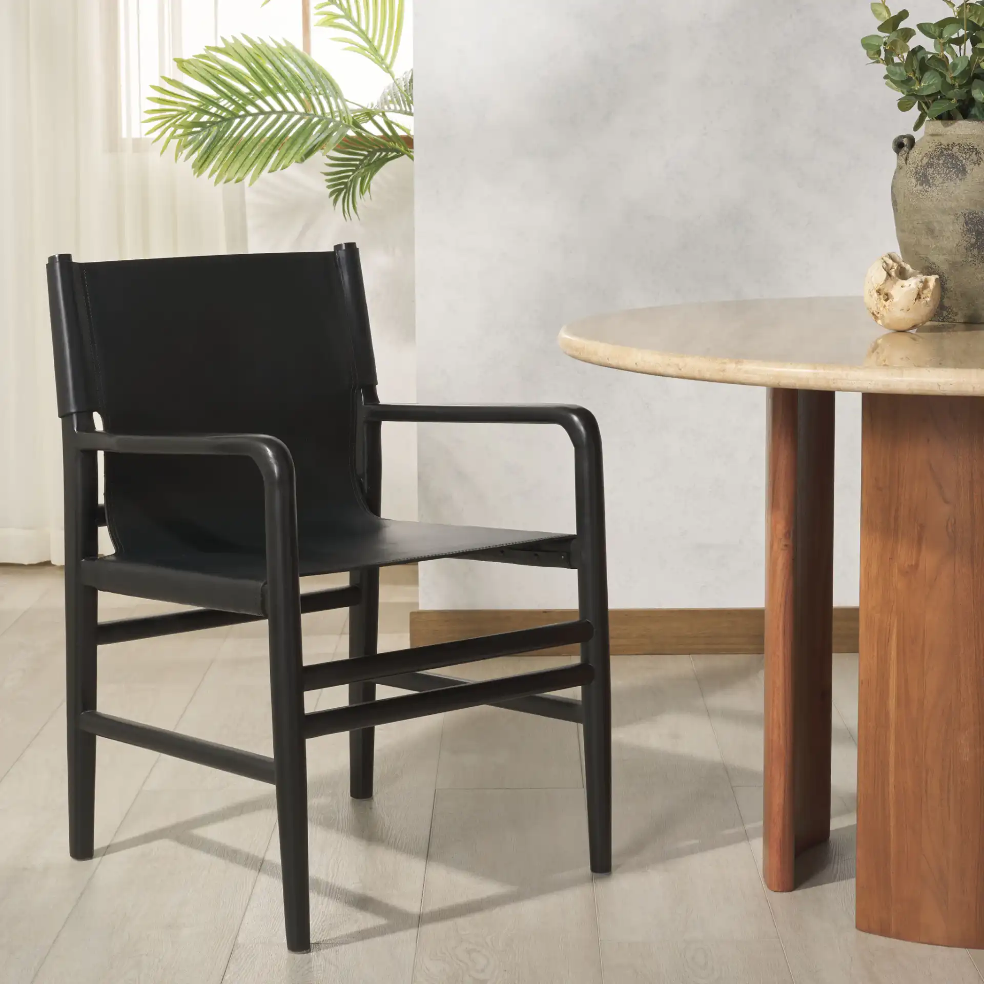 Cassaphina Leather Arm Chair in Black in a styled room