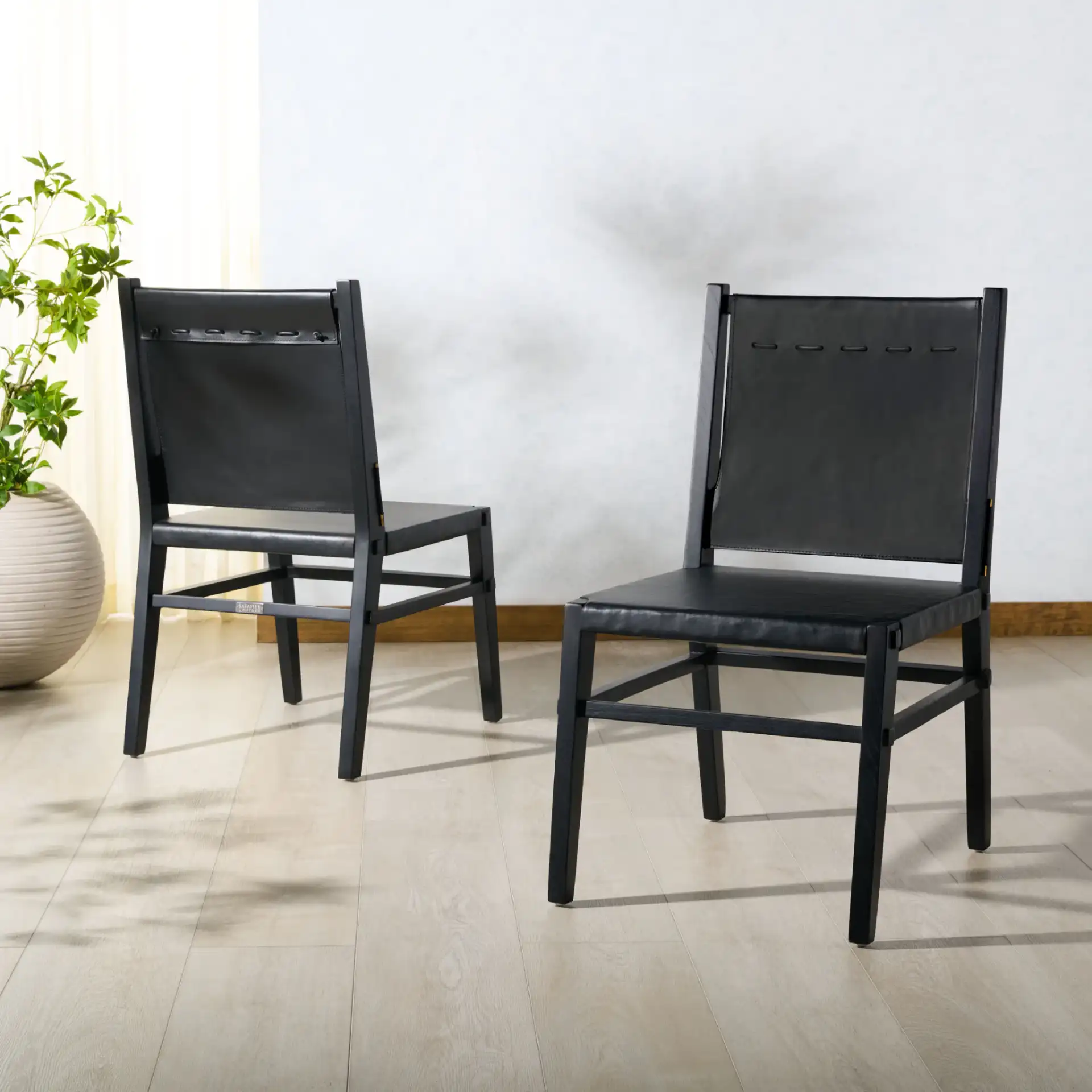 Catriella Leather Dining Chair (Set of 2) in Tan / Natural in a styled room