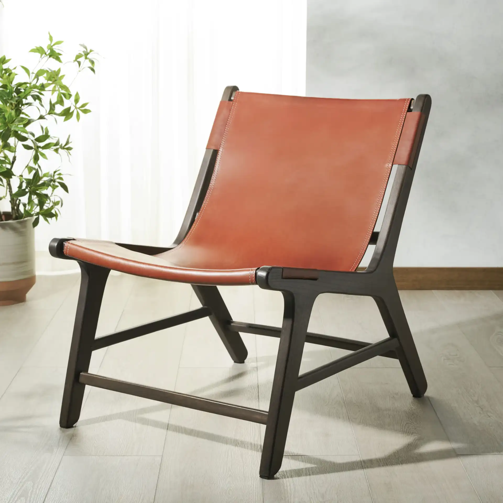 Alanarose Leather Accent Chair in Tan / Natural in a styled room