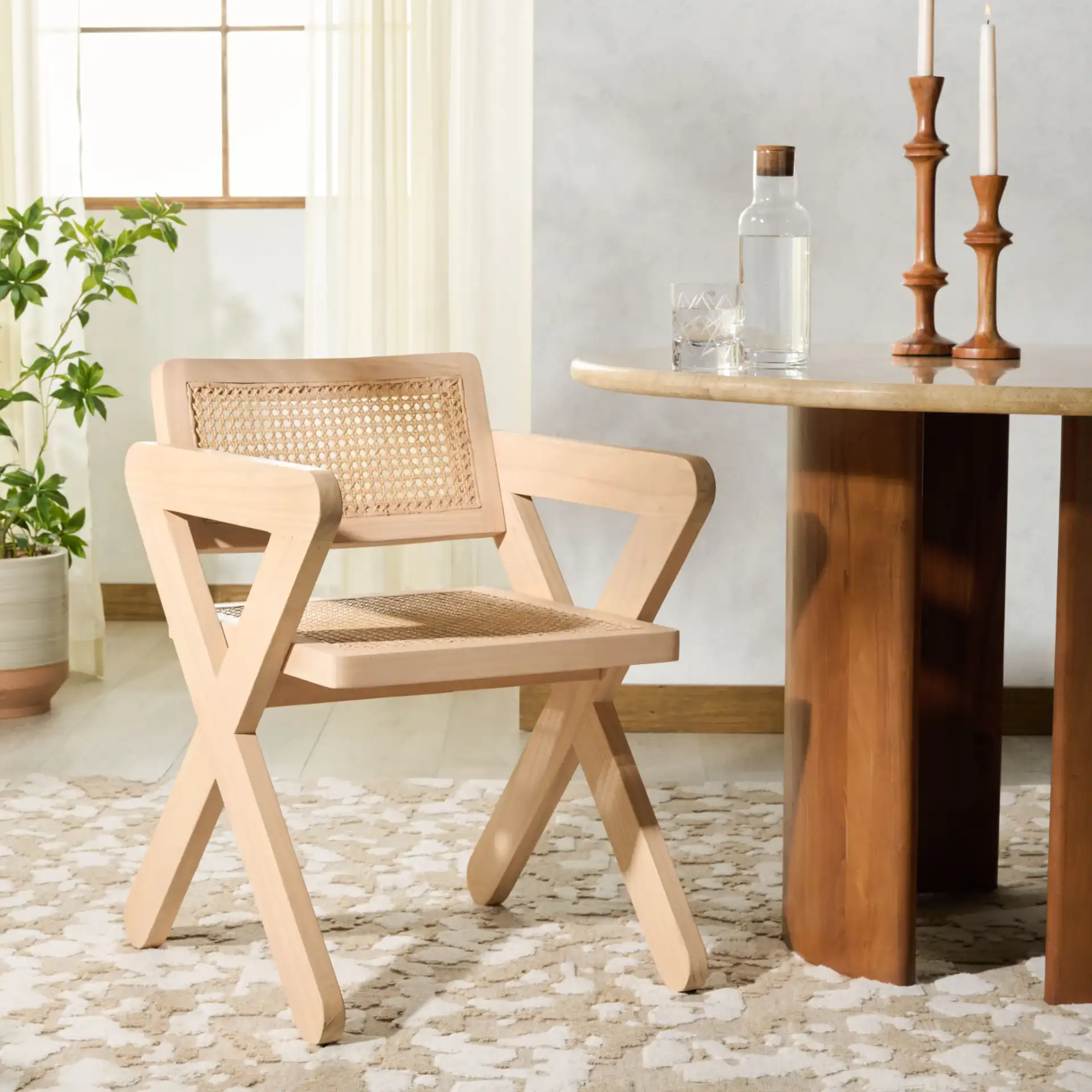 Tyrrell Rattan Dining Chair in Natural in a styled room