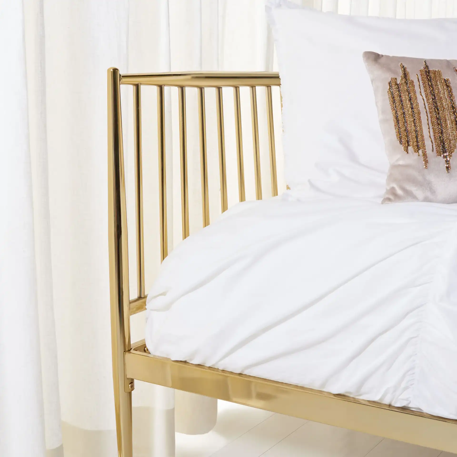Eliza Metal Bed in Gold in a styled room