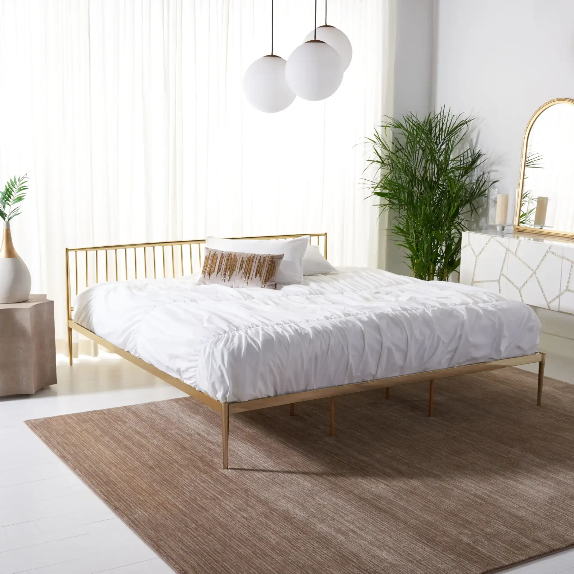 Eliza Metal Bed in Gold in a styled room