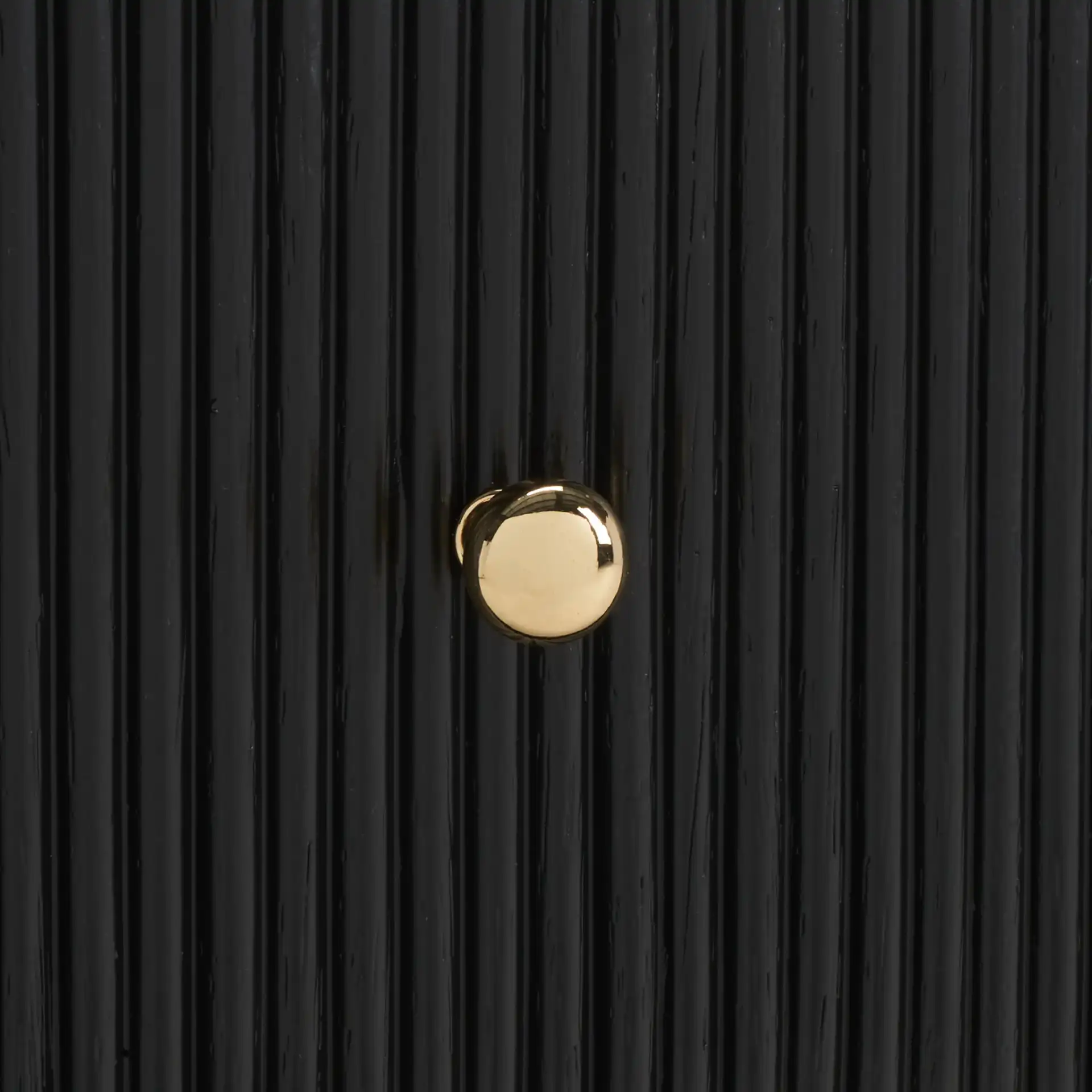 Liabella One-Drawer Curved Nightstand in Black / Gold in a styled room