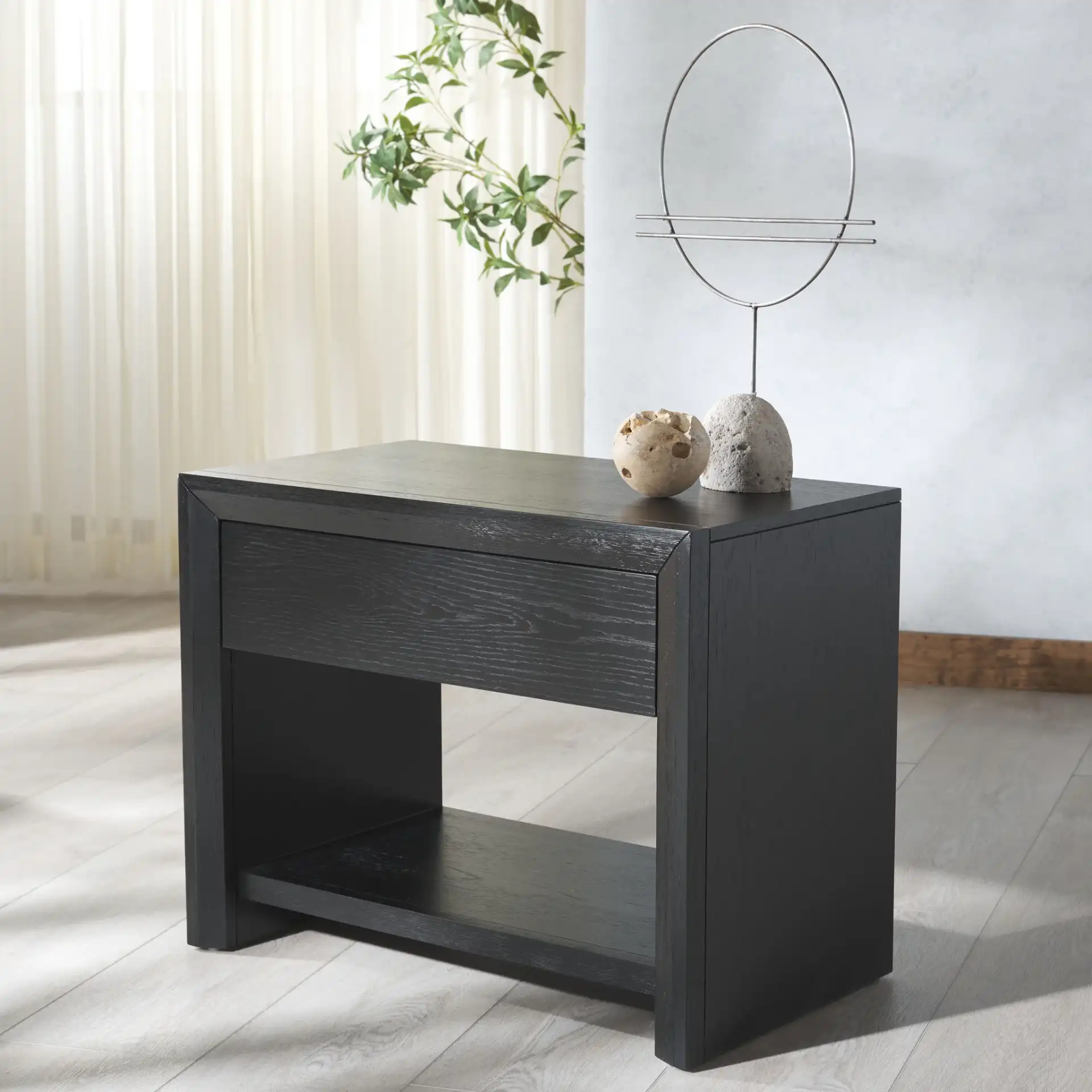 Darnell One-Drawer Nightstand in Black in a styled room
