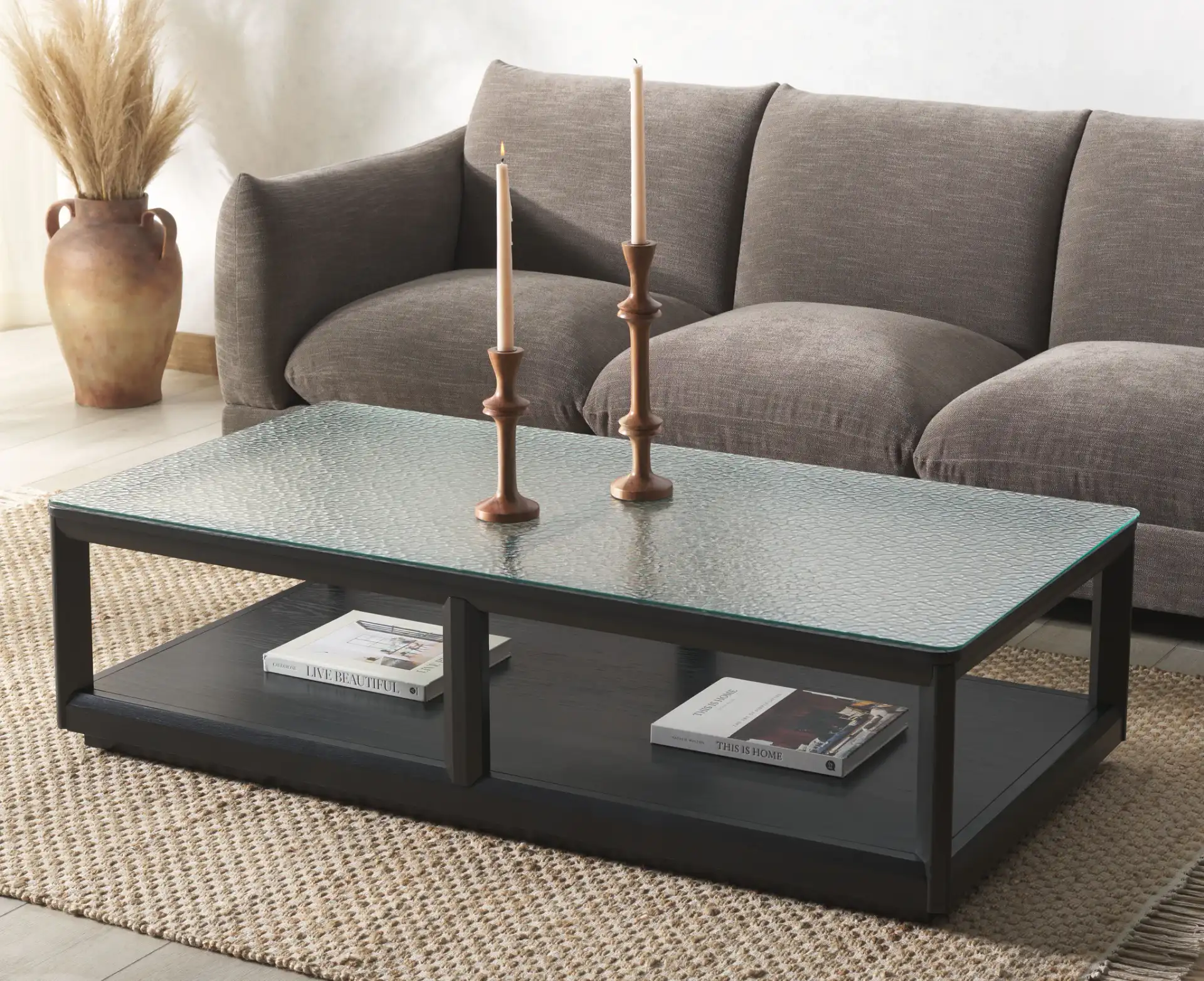 Benecarlo Glass Top Coffee Table in Black / Clear in a styled room