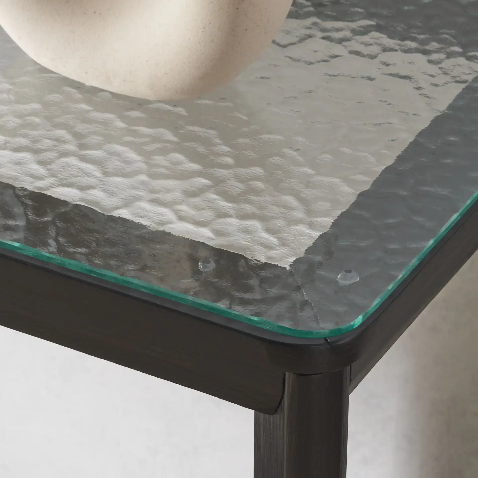 Benecarlo Glass Top Console Table in Black / Clear in a styled room