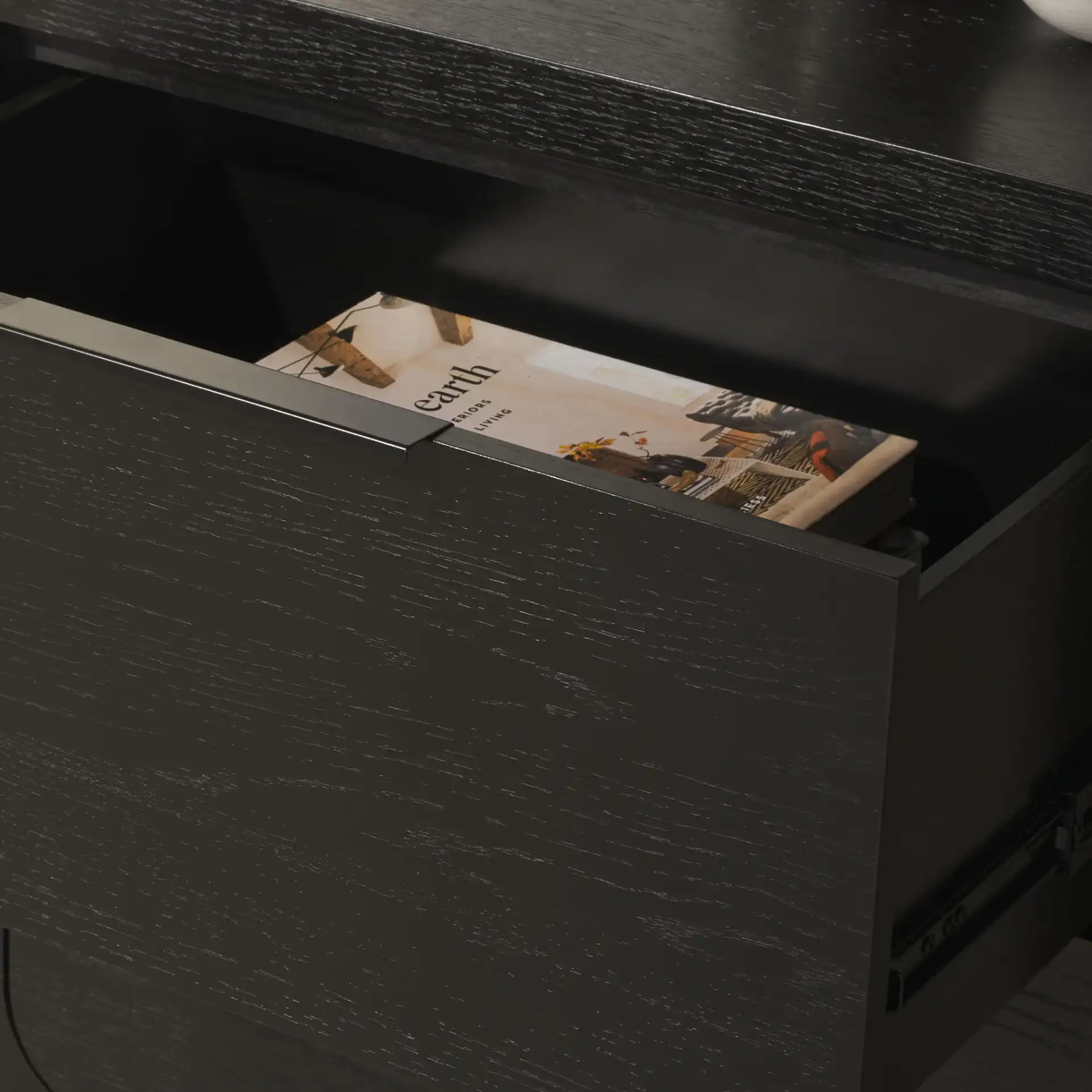 Raylie Two-Drawer Wood Nightstand in Black in a styled room