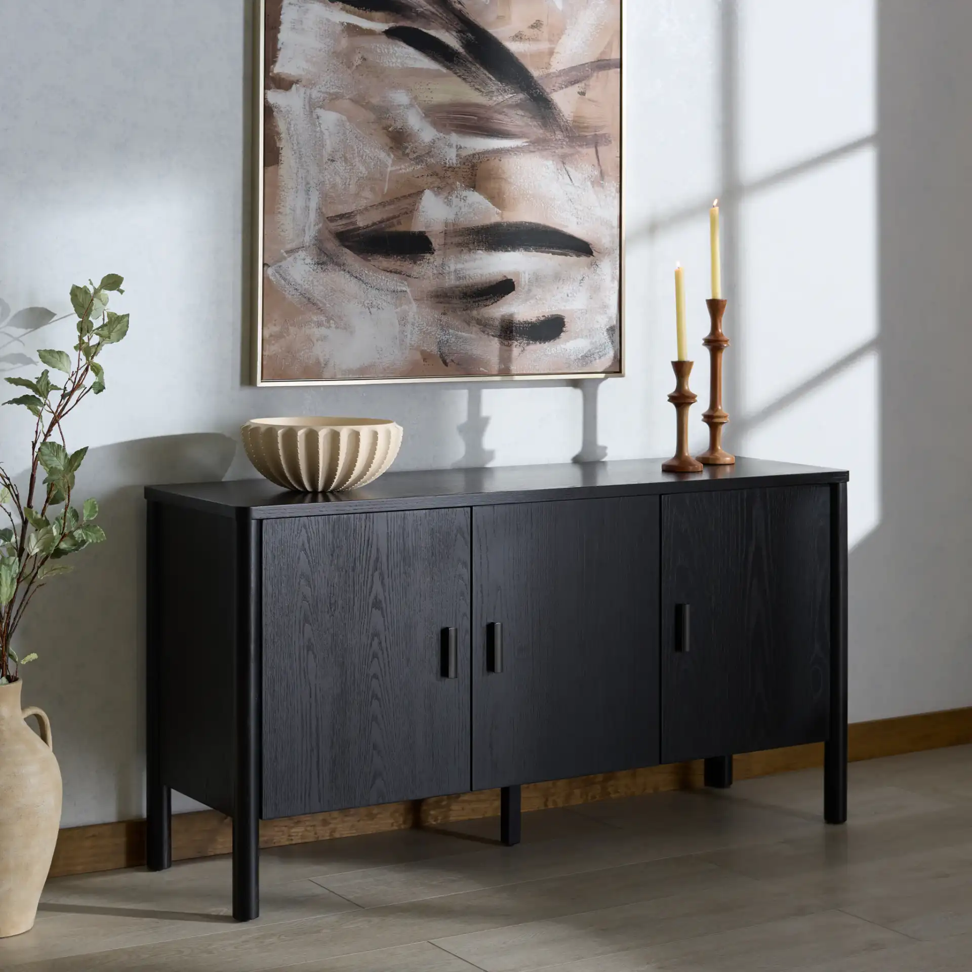 Jaylessa Wood Three-Door Sideboard in Natural in a styled room