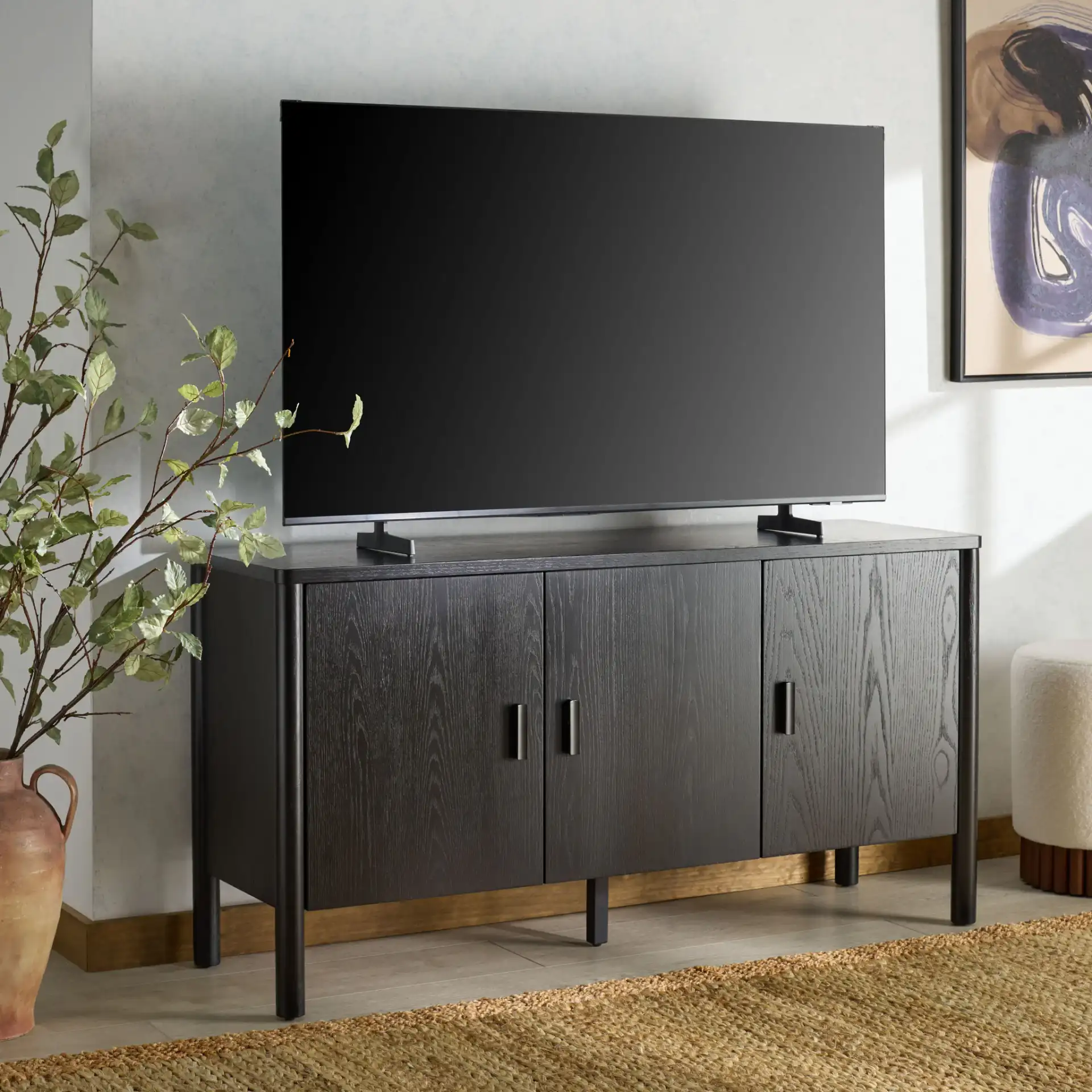 Jaylessa Wood Three-Door Sideboard in Natural in a styled room