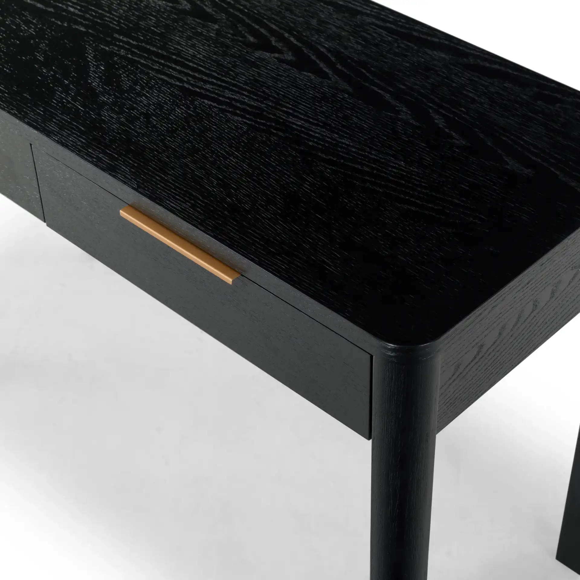 Gabrietta Two-Drawer Wood Desk in Black / Gold in a styled room