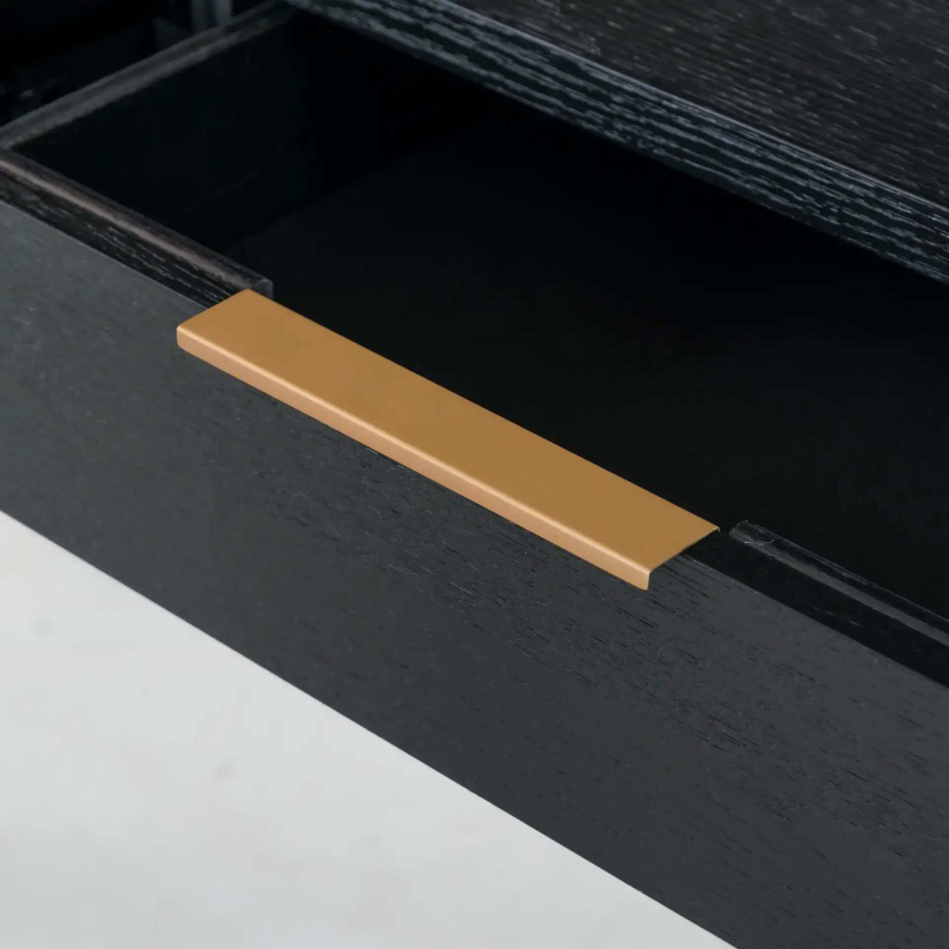 Gabrietta Two-Drawer Wood Desk in Black / Gold in a styled room