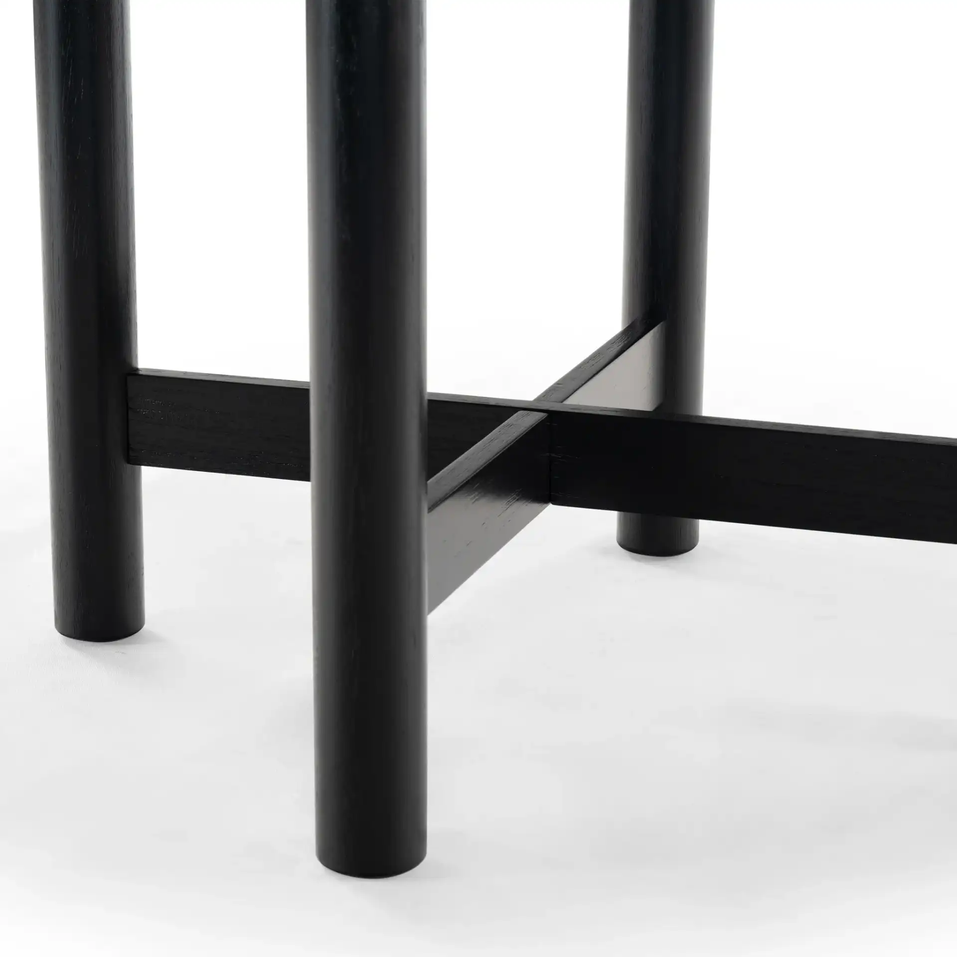 Ruthanne Wood 47-Inch Dining Table in Black in a styled room