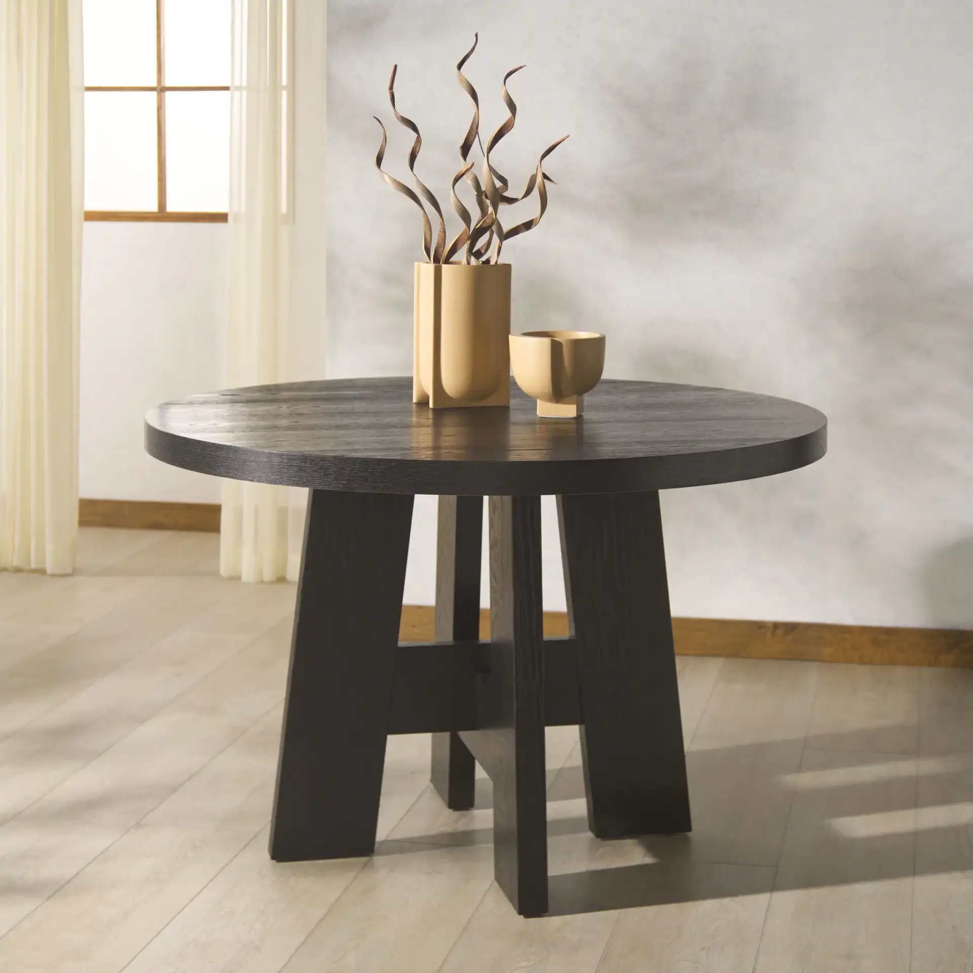 Beverley Wood 47" Dining Table in Black in a styled room