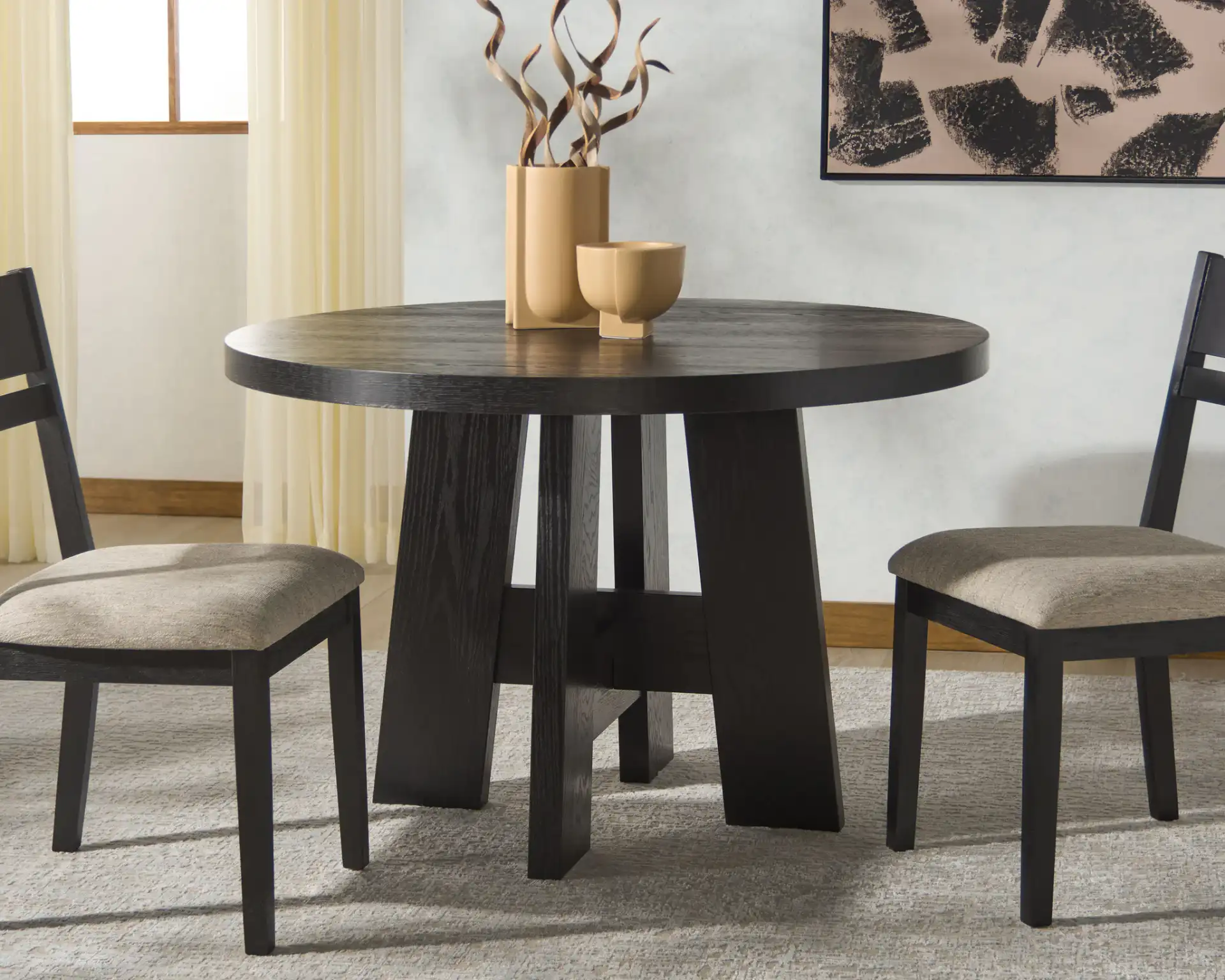 Beverley Wood 47" Dining Table in Black in a styled room