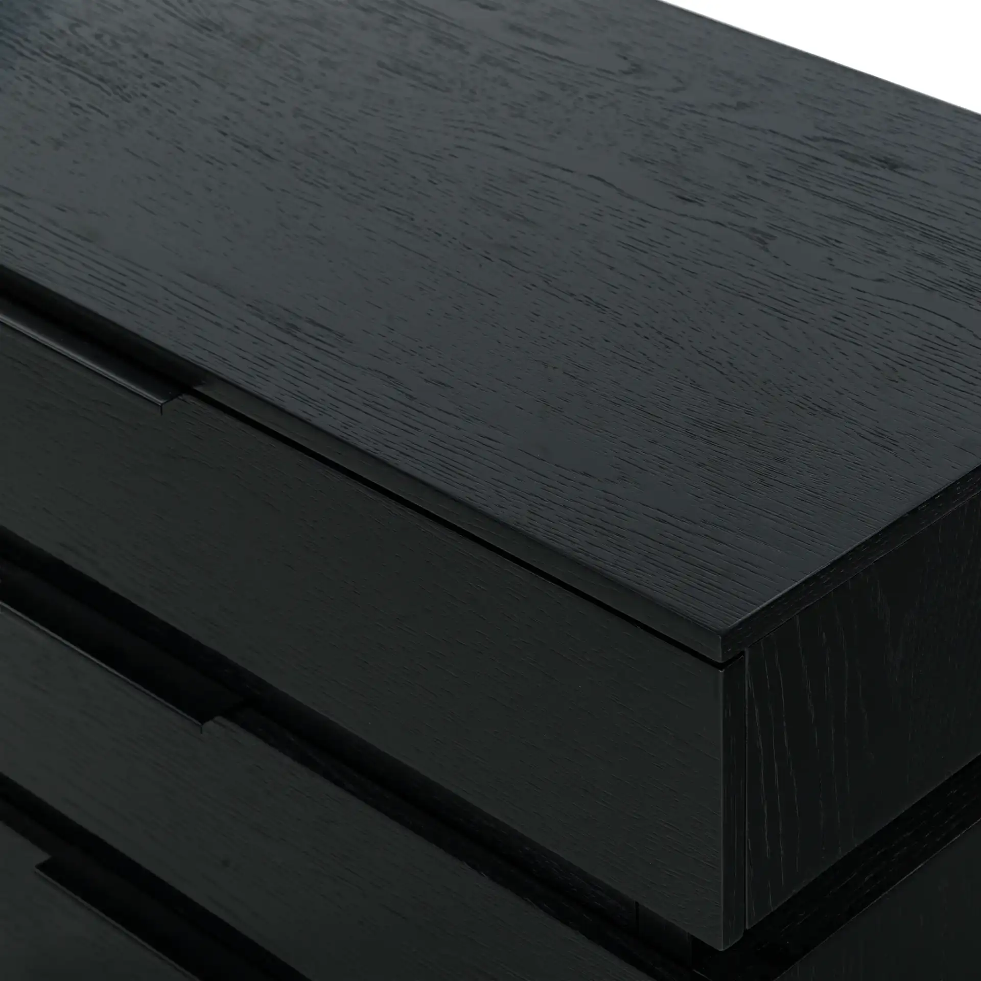Titus Three-Drawer Stacked Chest in Black in a styled room