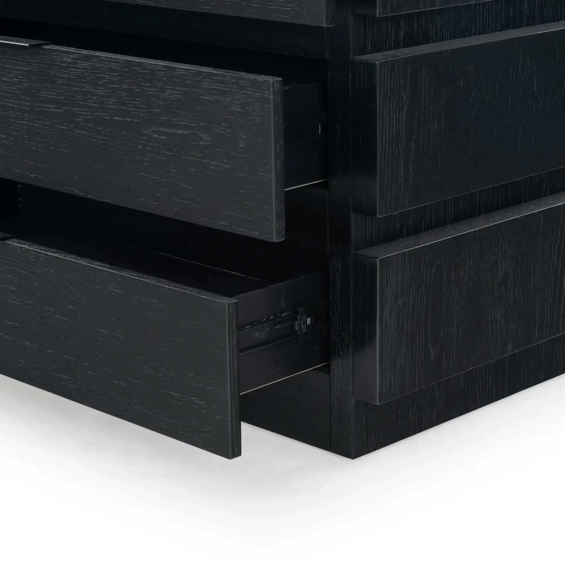 Titus Three-Drawer Stacked Chest in Black in a styled room